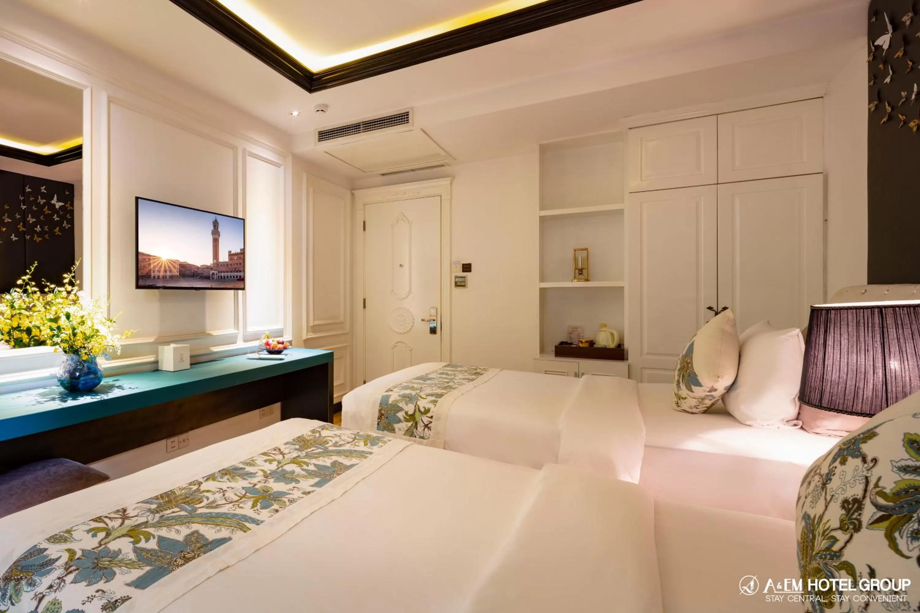 Bed in A&EM Saigon Hotel