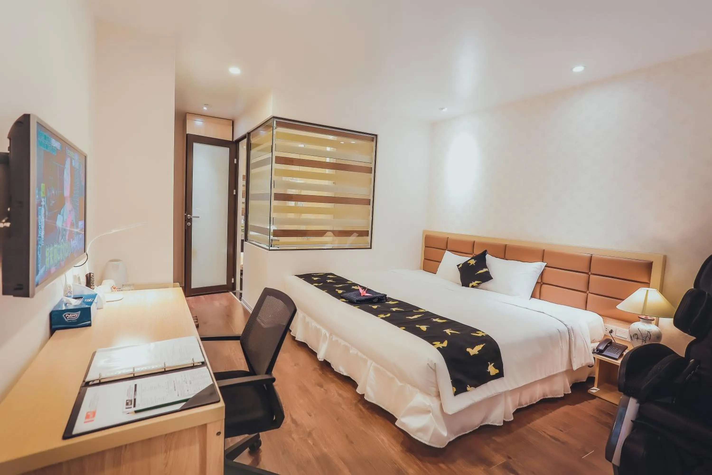 Bed in Momizi Business Hotel