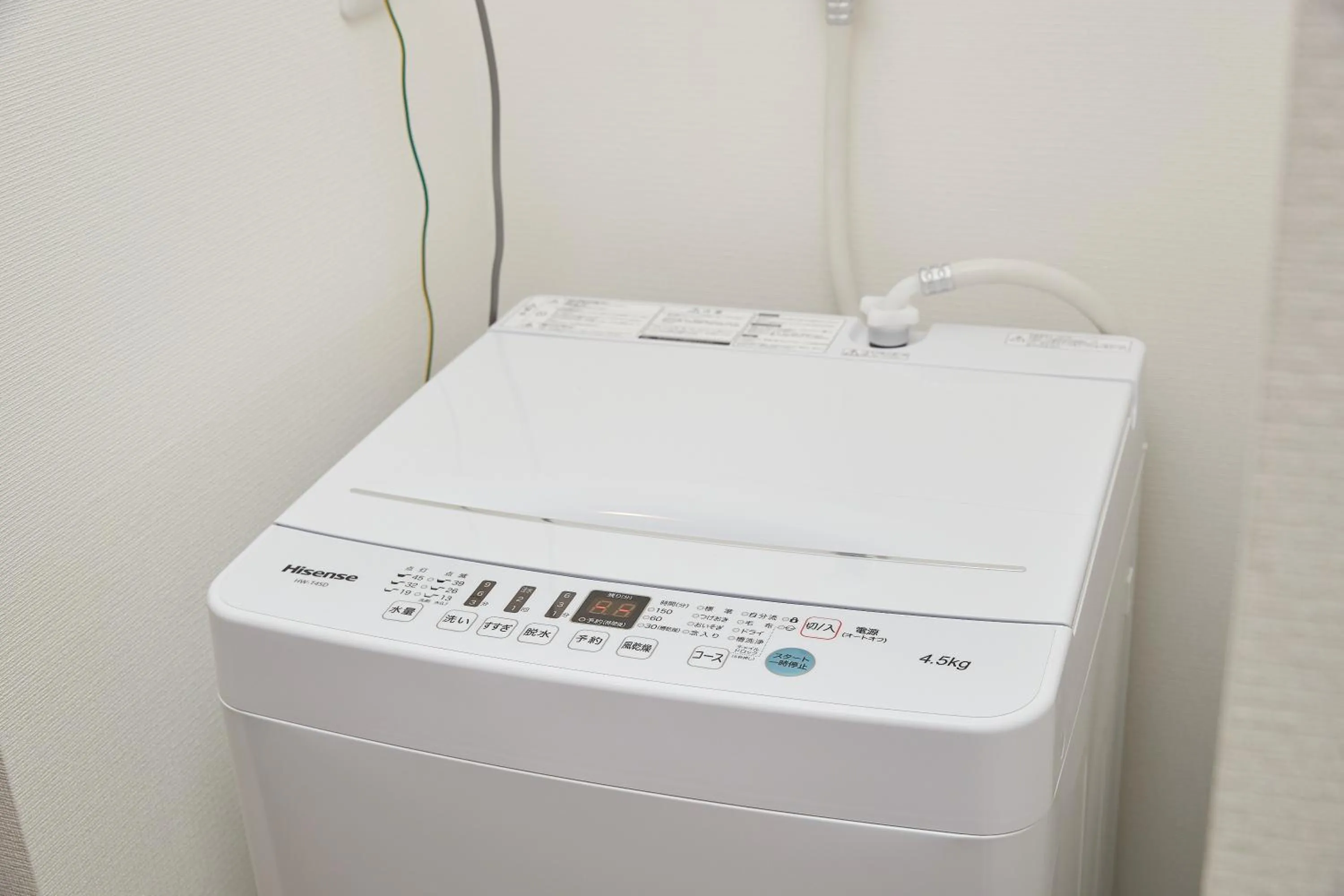 washing machine in New Normal Hotel in NAMINOUE ニューノーマルホテルイン波の上