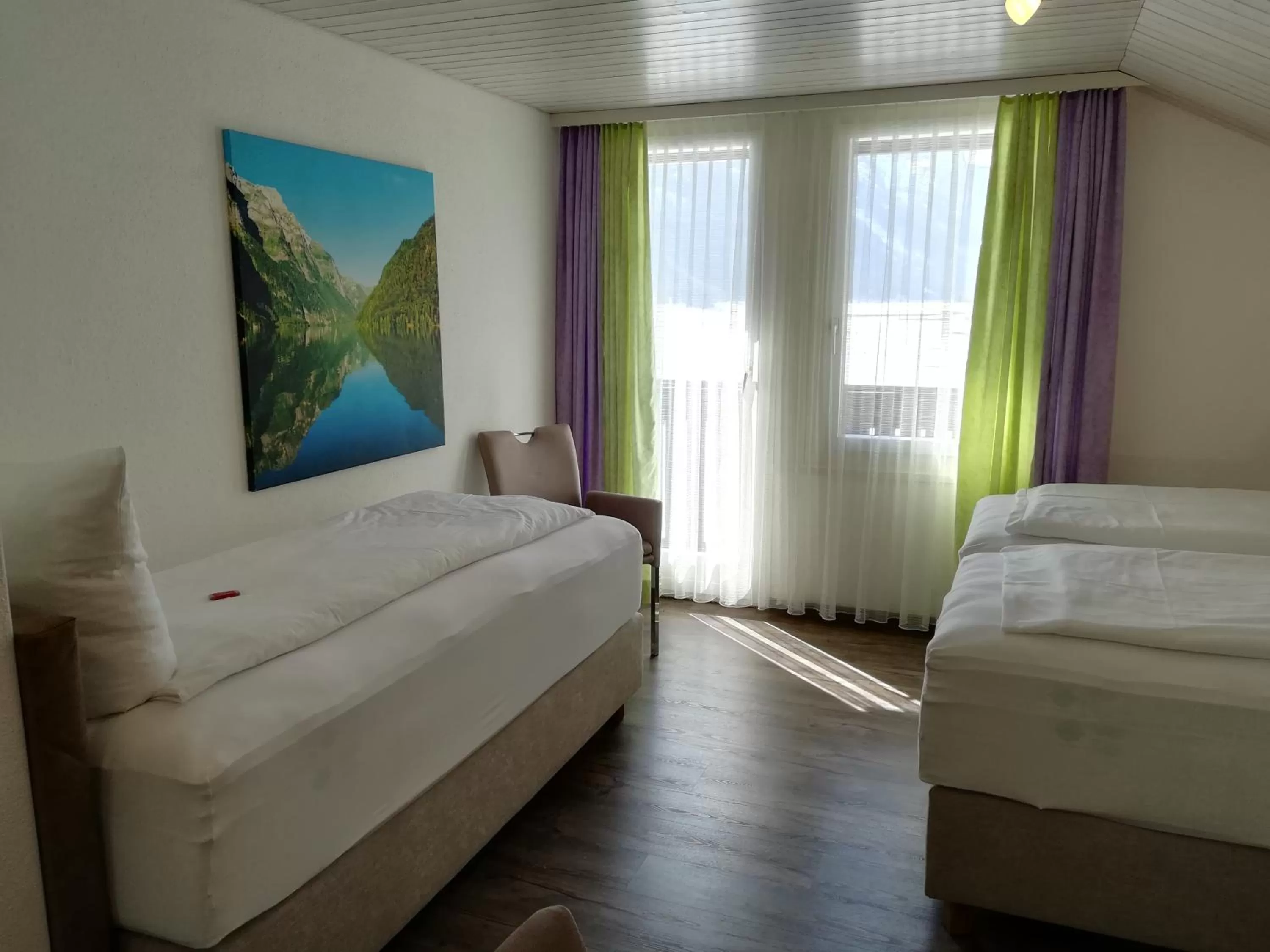 Photo of the whole room, Bed in Hotel Rhodannenberg AG