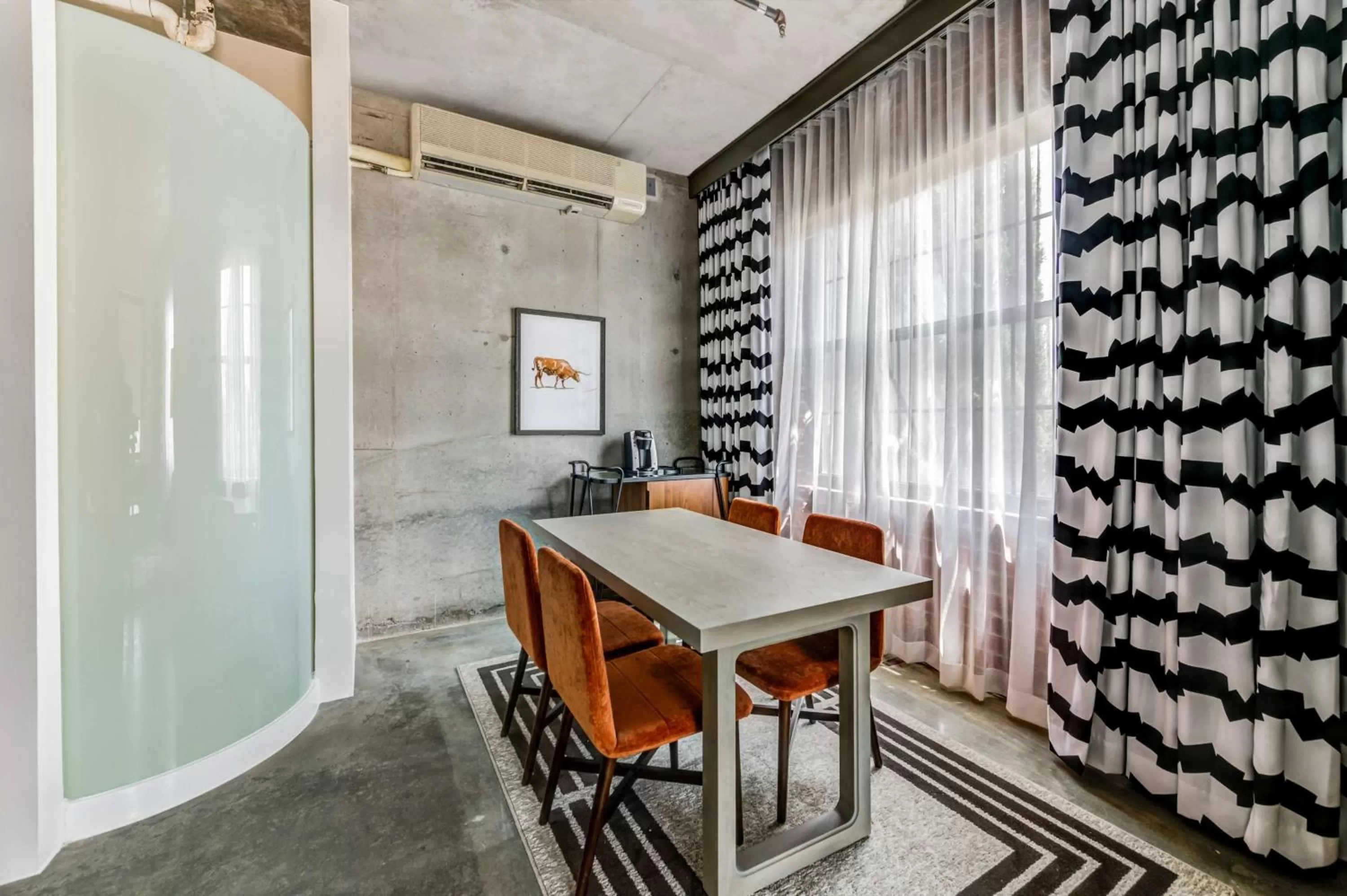 Living room in NYLO Dallas Plano Hotel, Tapestry Collection by Hilton