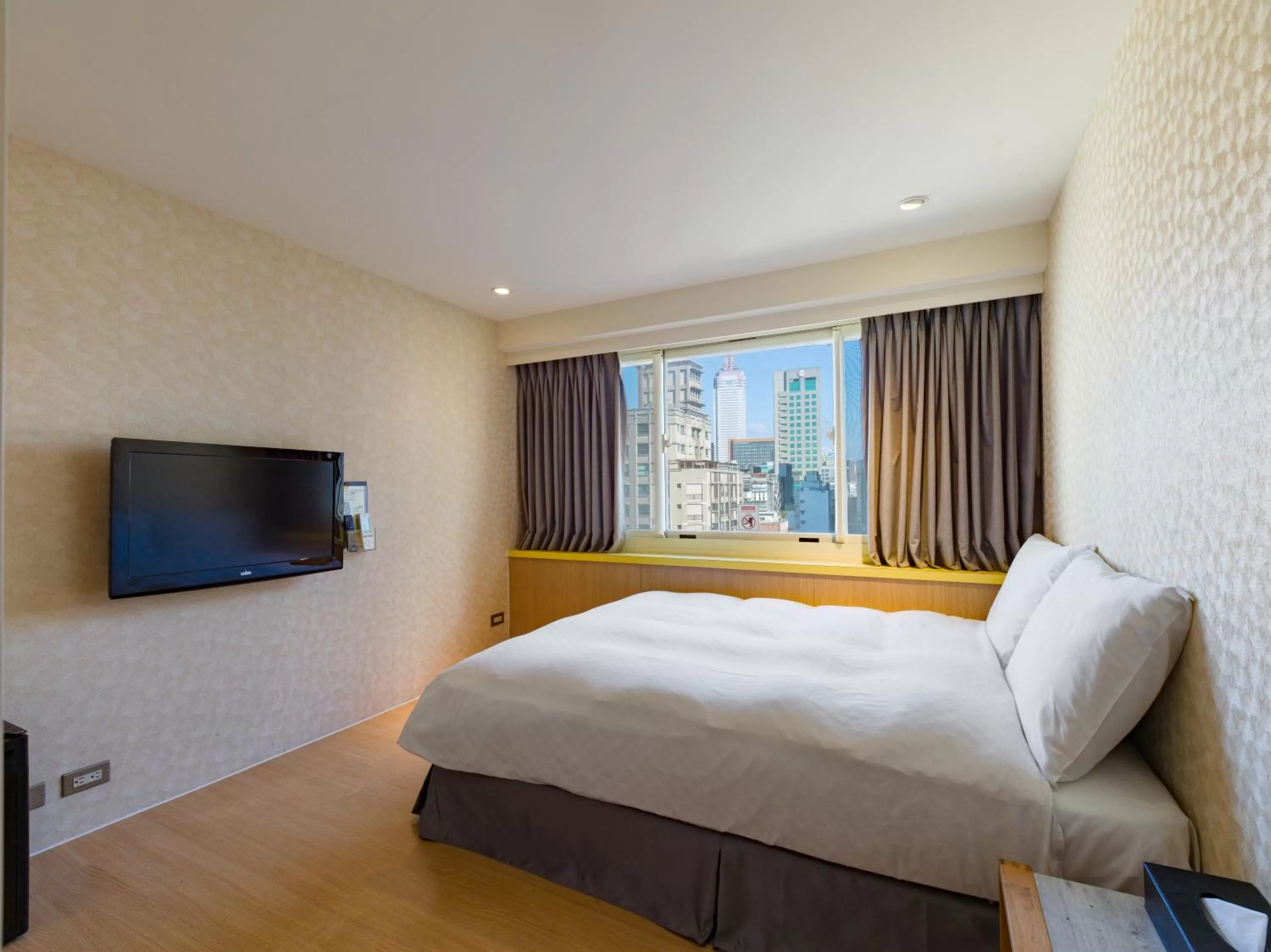 Bed in Ximenhotel-Xining西門大飯店-西寧館