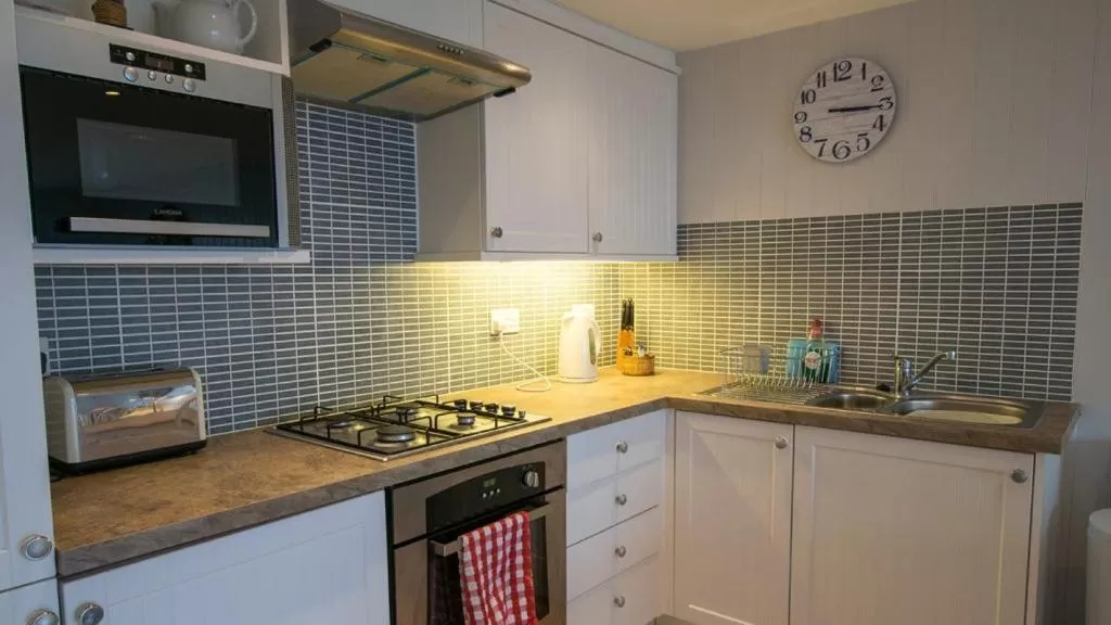 Kitchen or kitchenette in Chesil Beach Lodge Burton Bradstock Dorset DT64RJ
