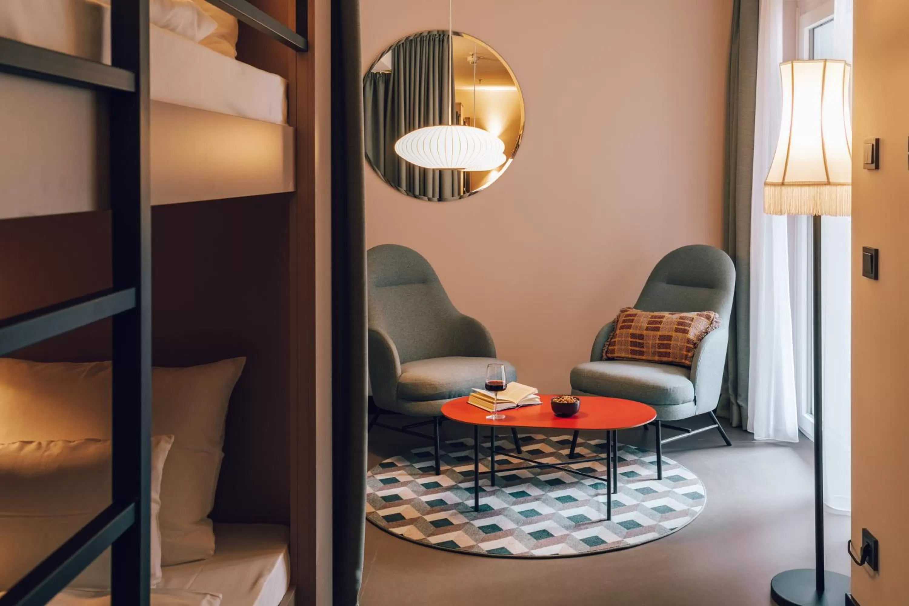 Seating area, Bed in Revo Munich