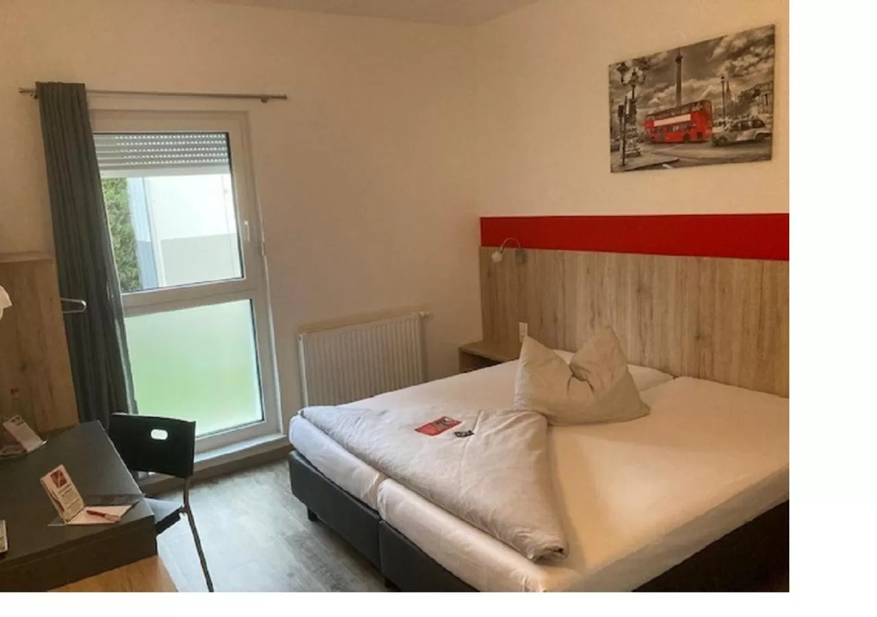 Photo of the whole room, Bed in Hotel Hohenloher Tor