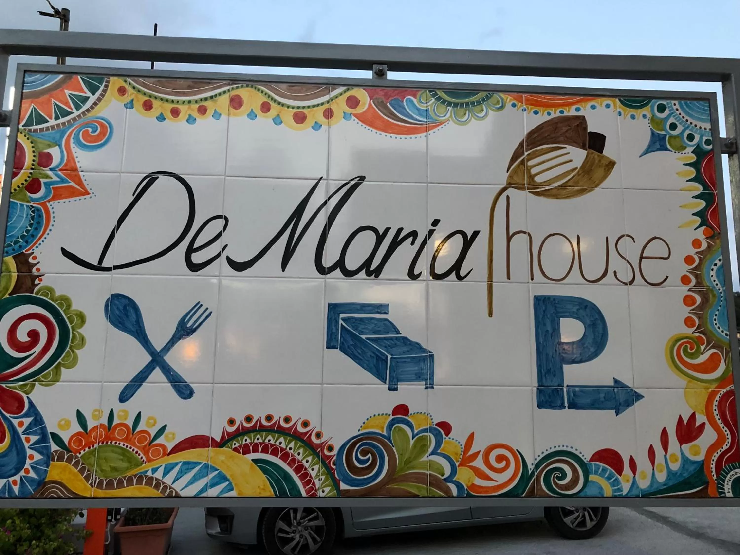 Property logo or sign in De Maria House