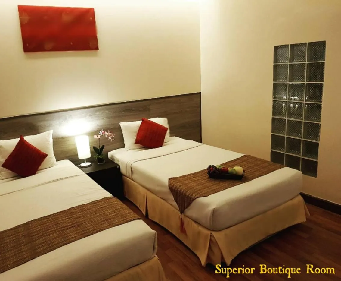 Bed in Maninarakorn Hotel