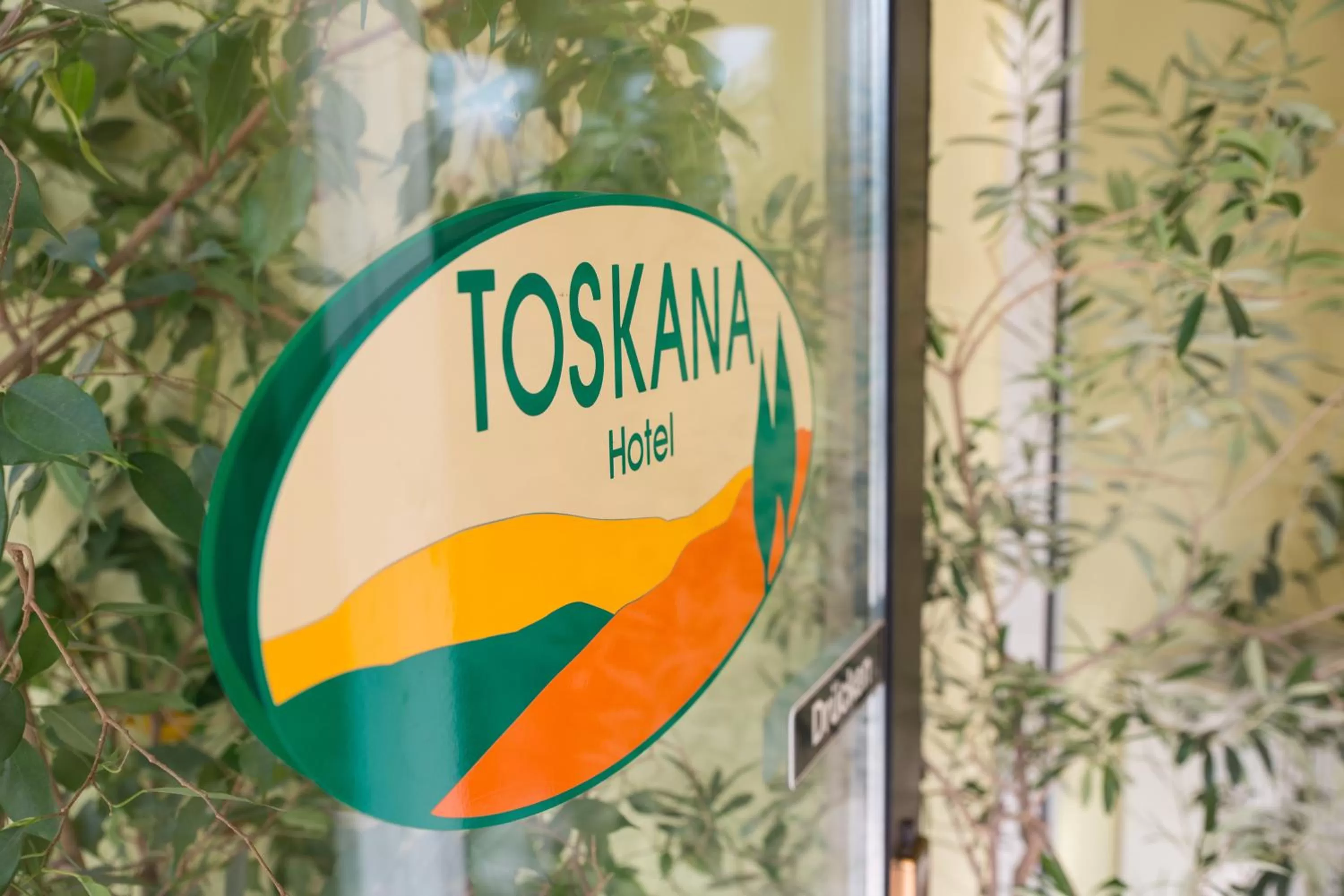 Property logo or sign in Hotel Toskana