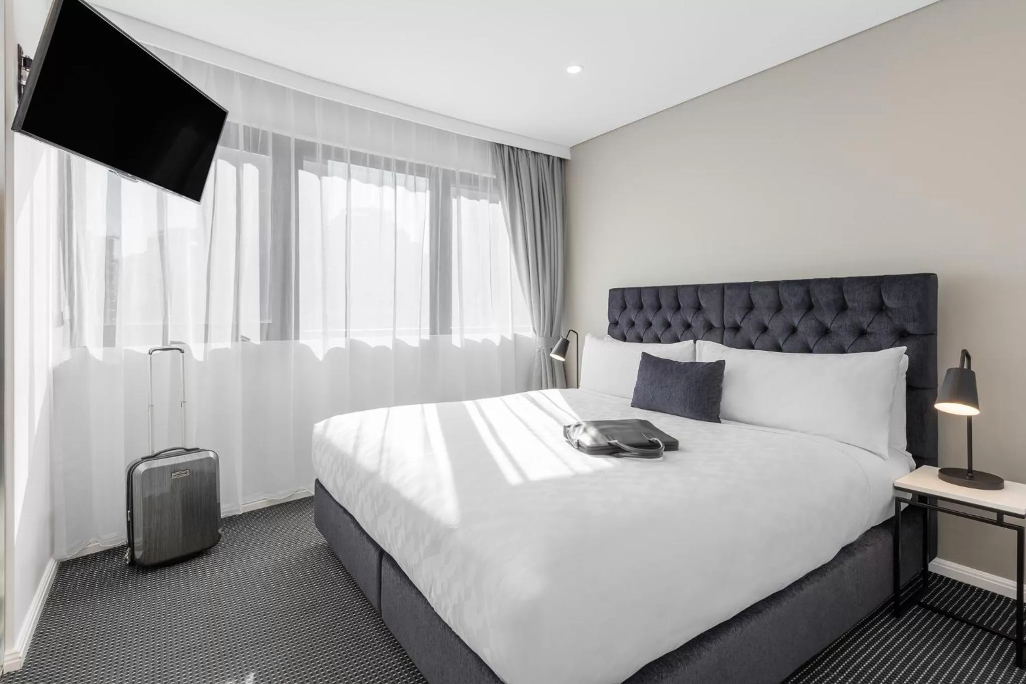 Bed in Meriton Suites Kent Street, Sydney