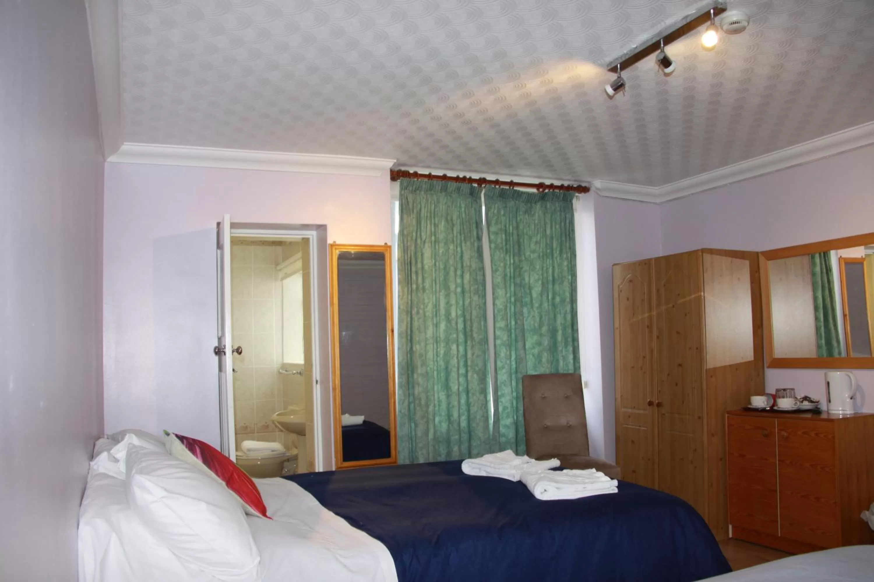 Bed in Ambassador Hotel