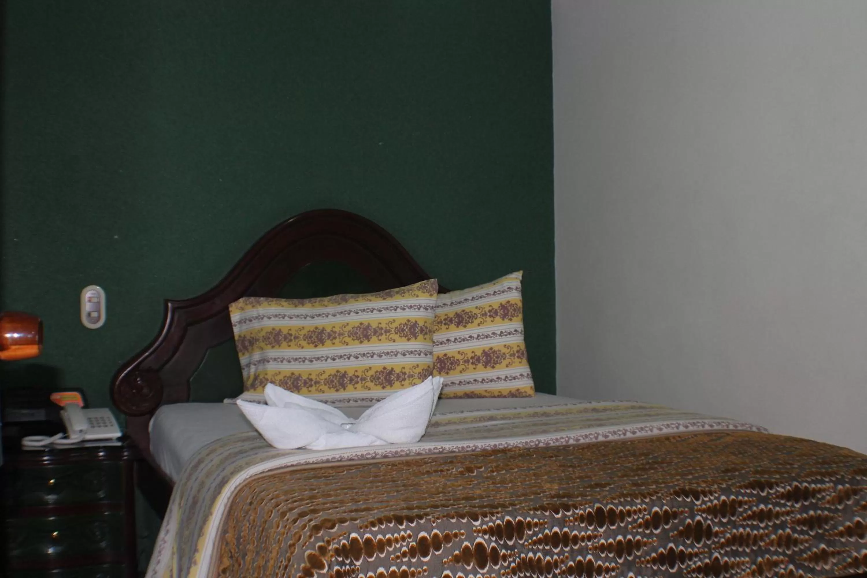 Bed in Lafont Park Hotel