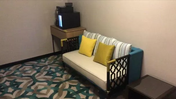 Bed in CHRISTEE SUITES HOTEL