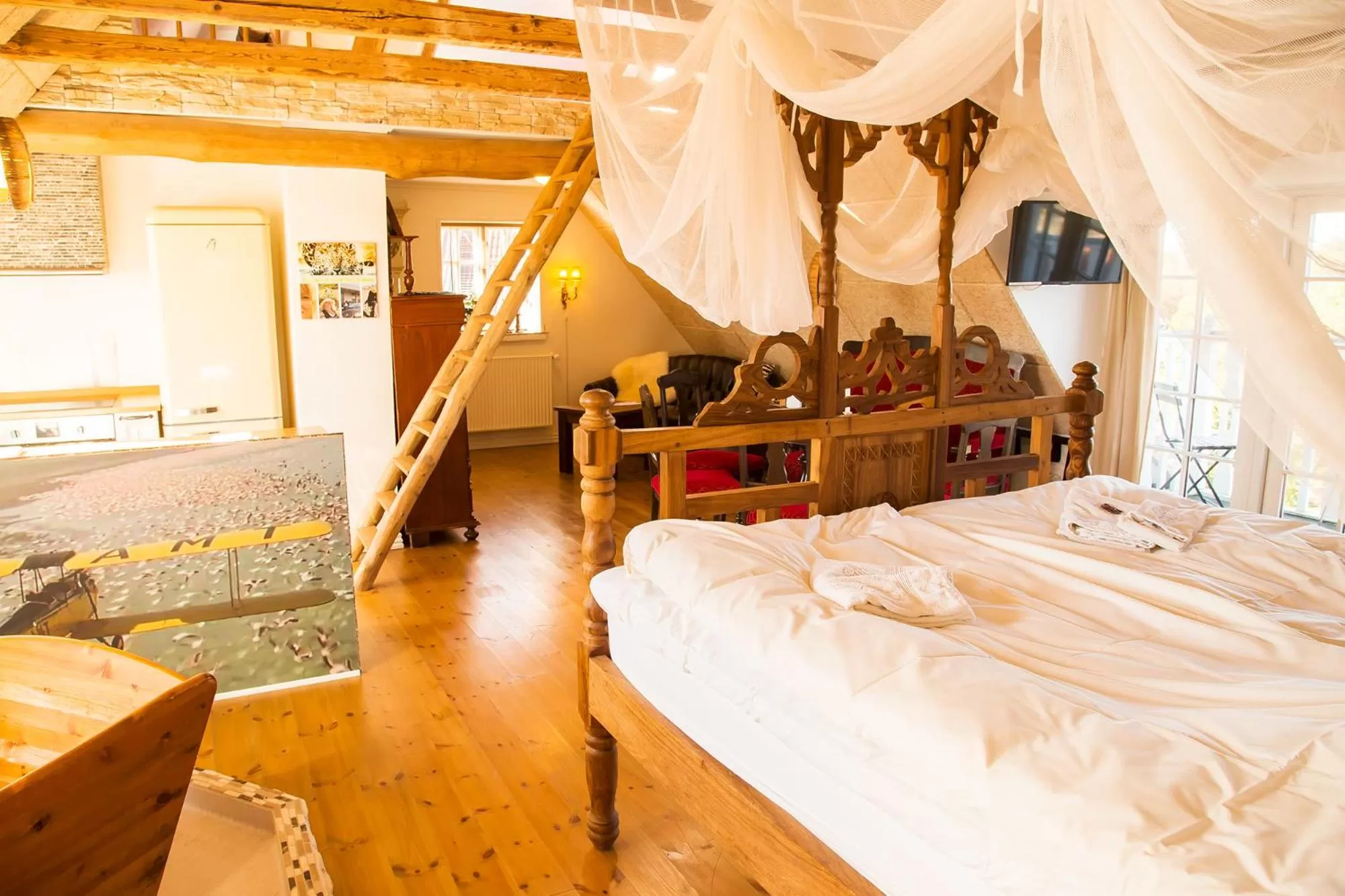 Living room, Bed in Boutique Hotel Postgården