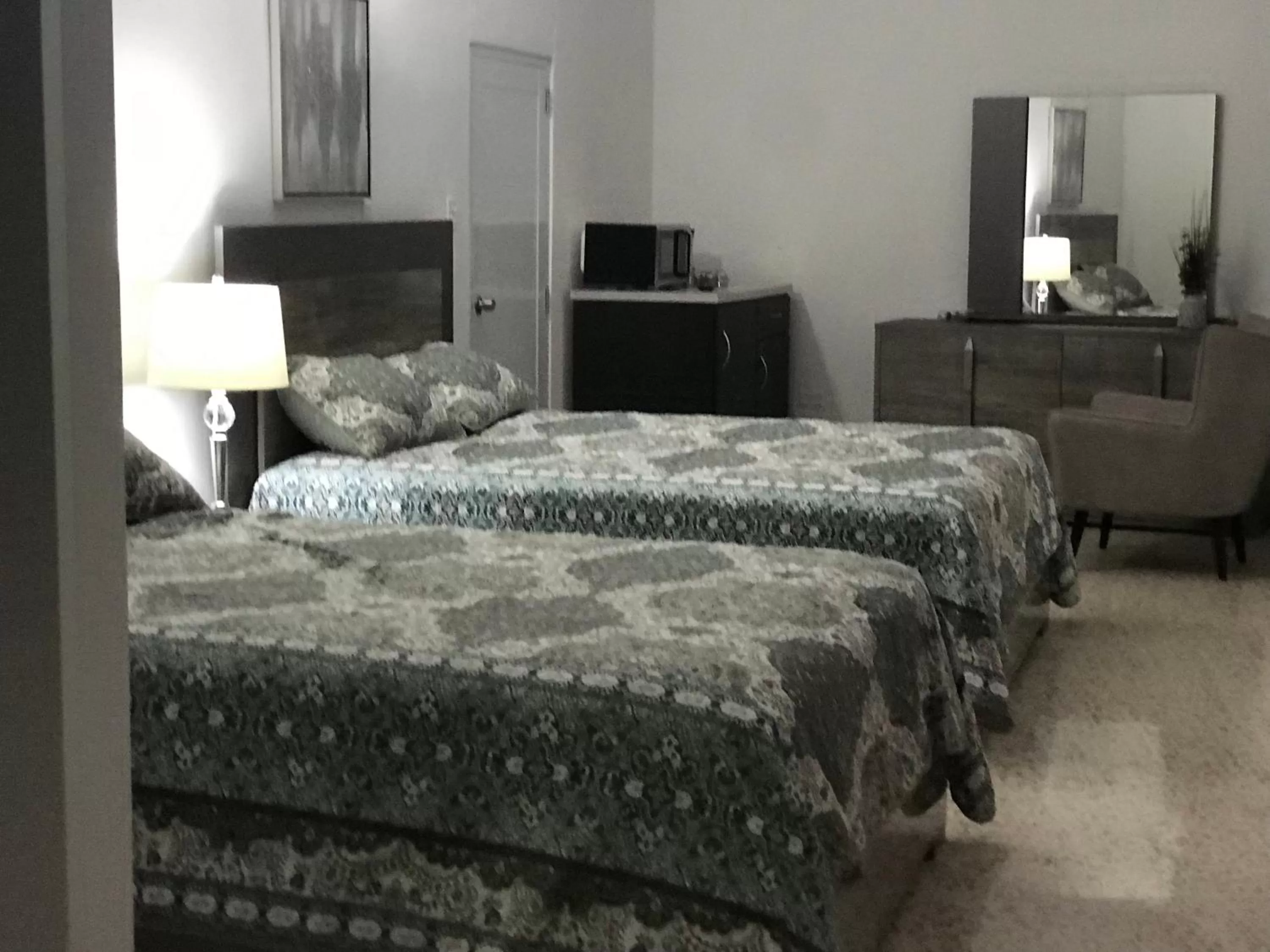 Bed in Itza-Bella Suites