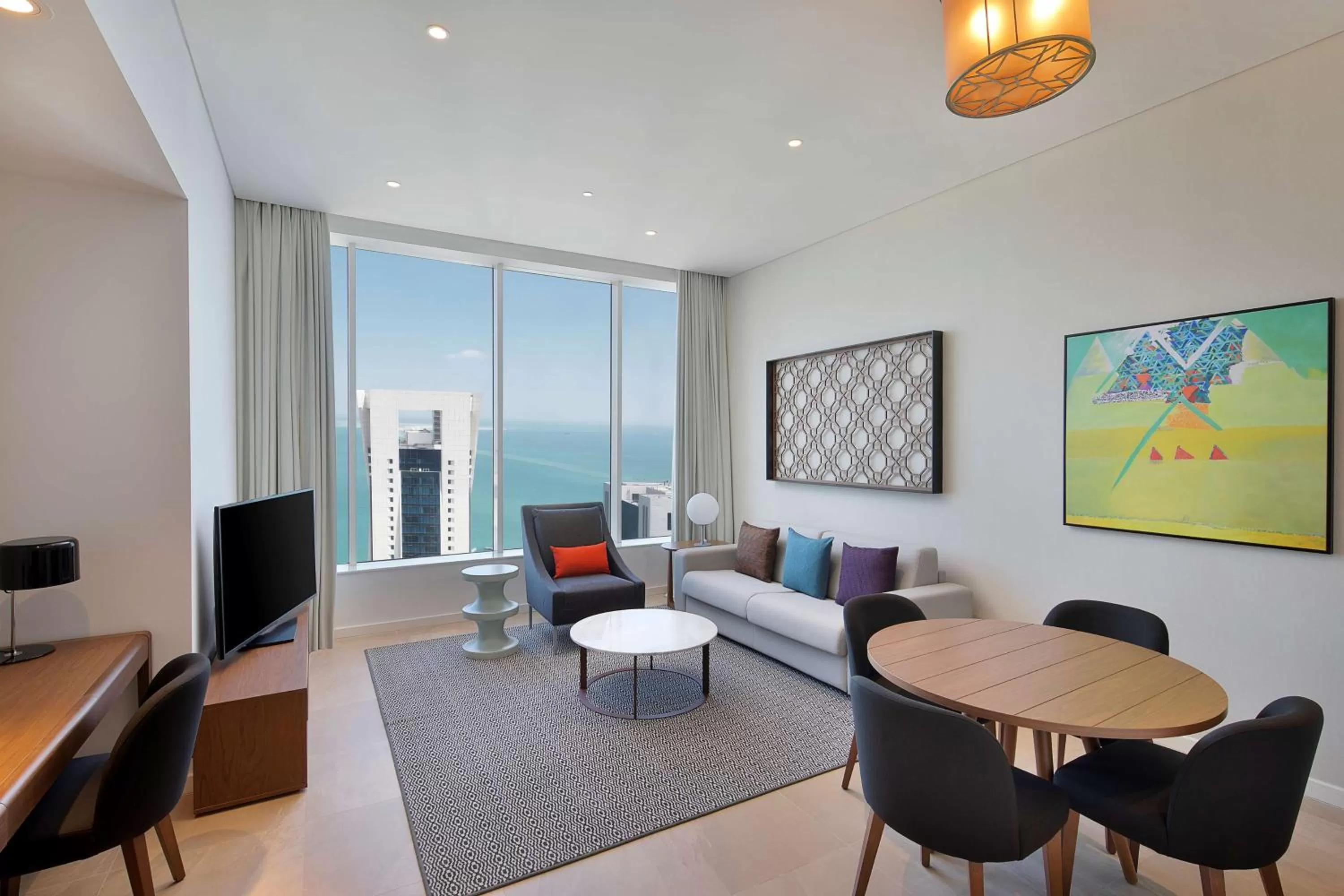 Living room in Aleph Doha Residences, Curio Collection By Hilton