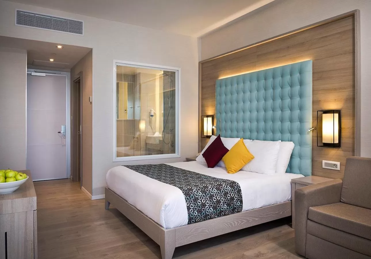 Bed in Astral Village Hotel