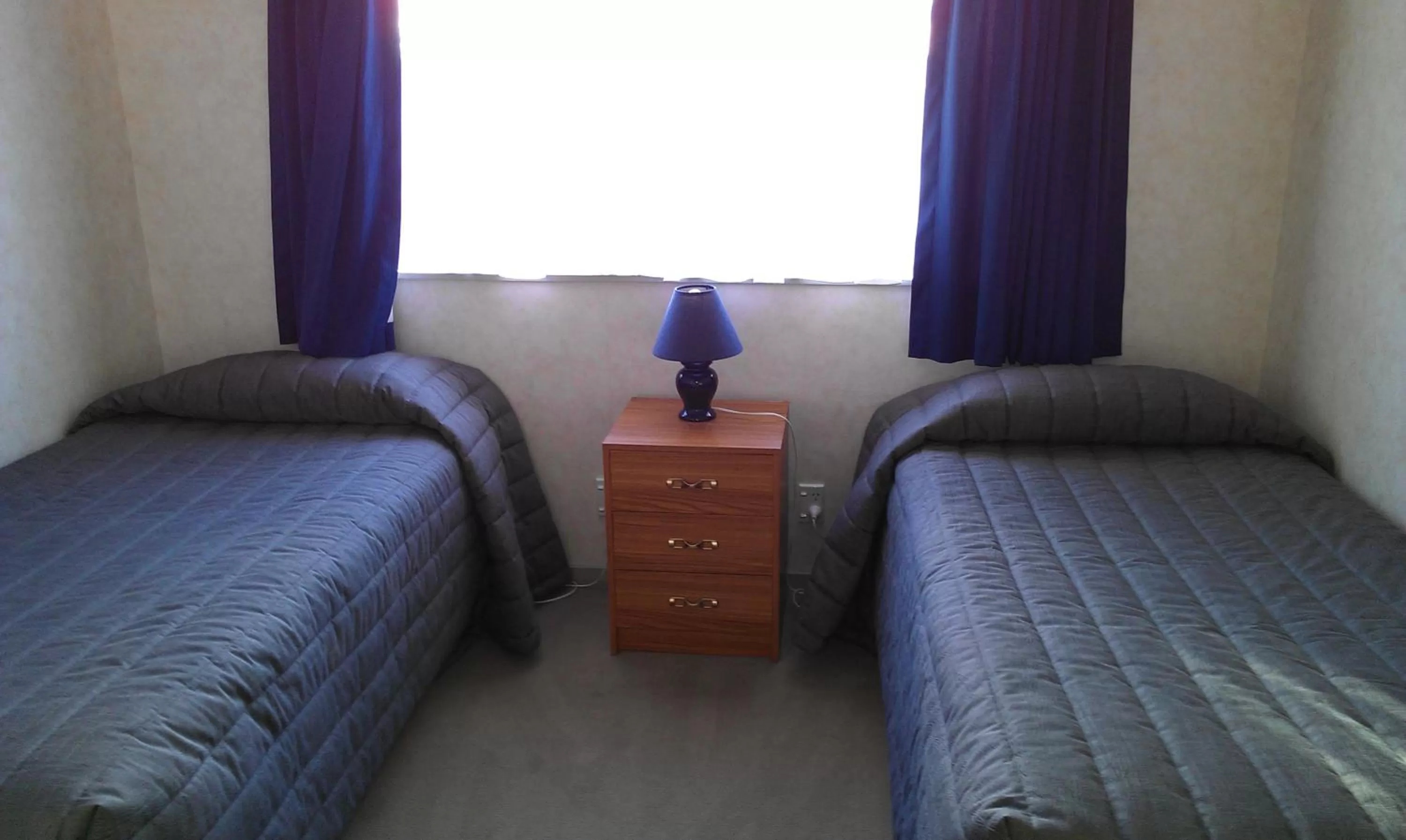 Bed in Riverview Motel