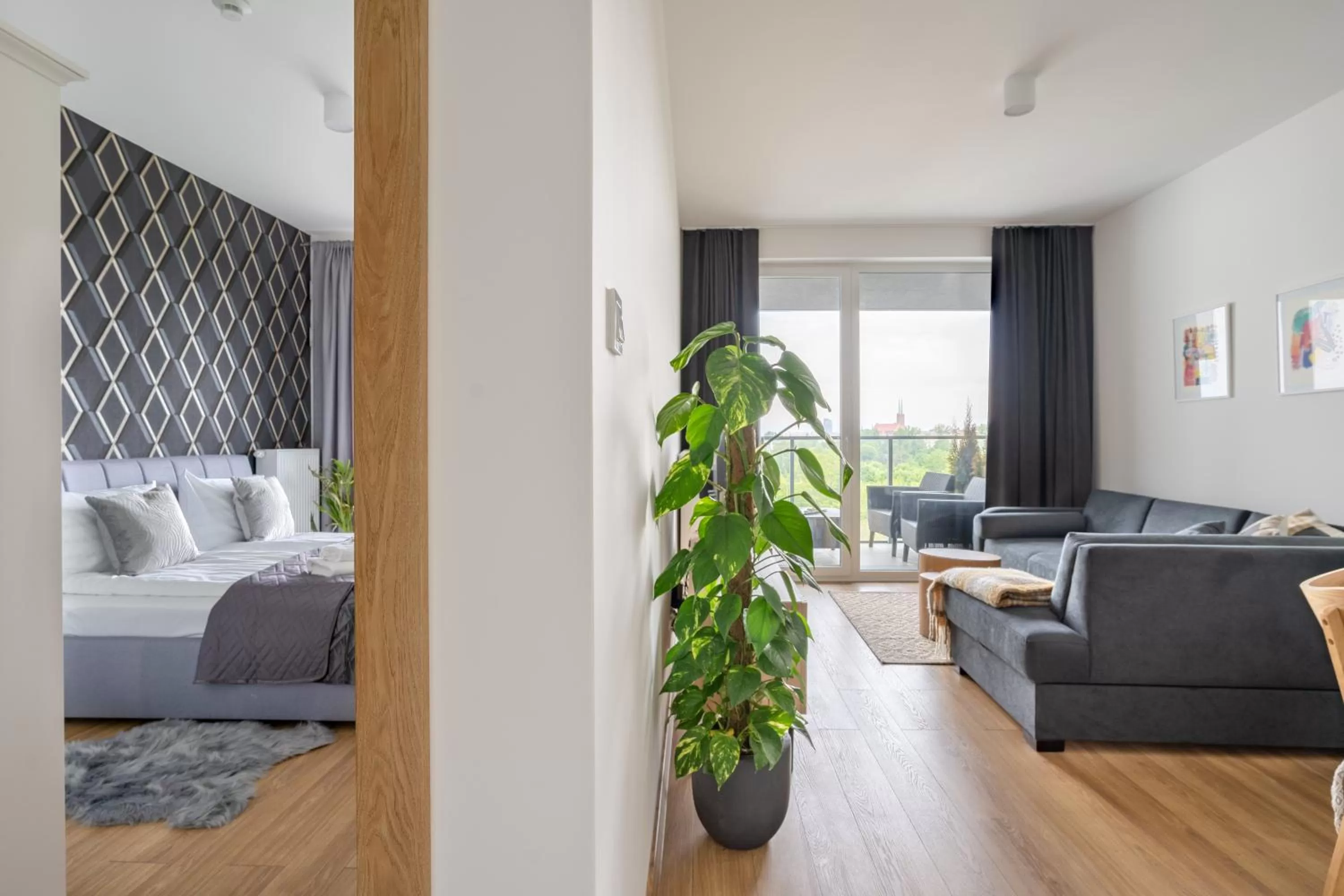 Bed in Symphony Modern Tower Apartamenty