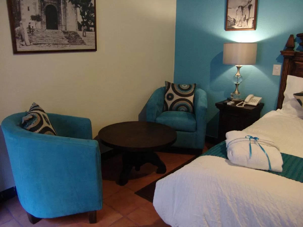 Seating area, Bed in Casa del Tio Hotel Boutique