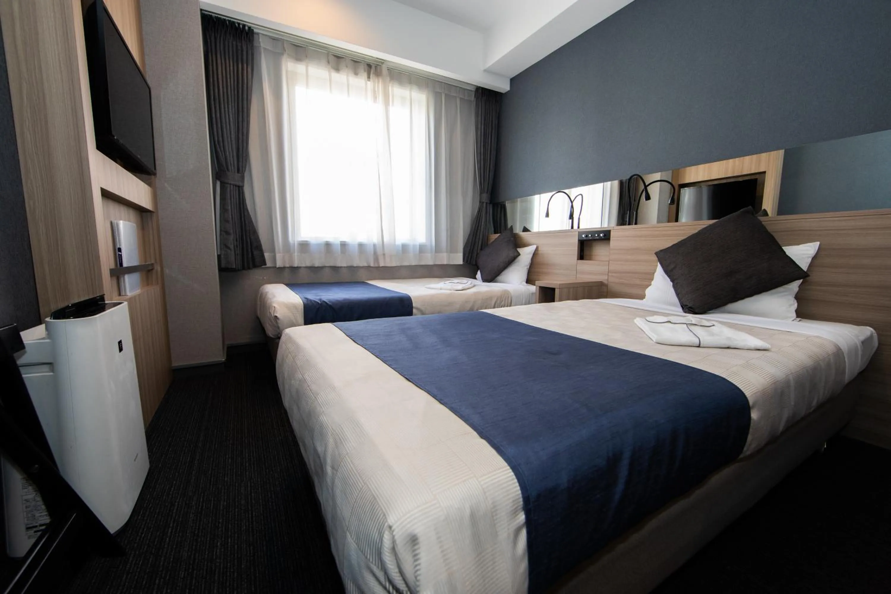 Photo of the whole room, Bed in Quintessa Hotel Osaka Shinsaibashi Comic & Books