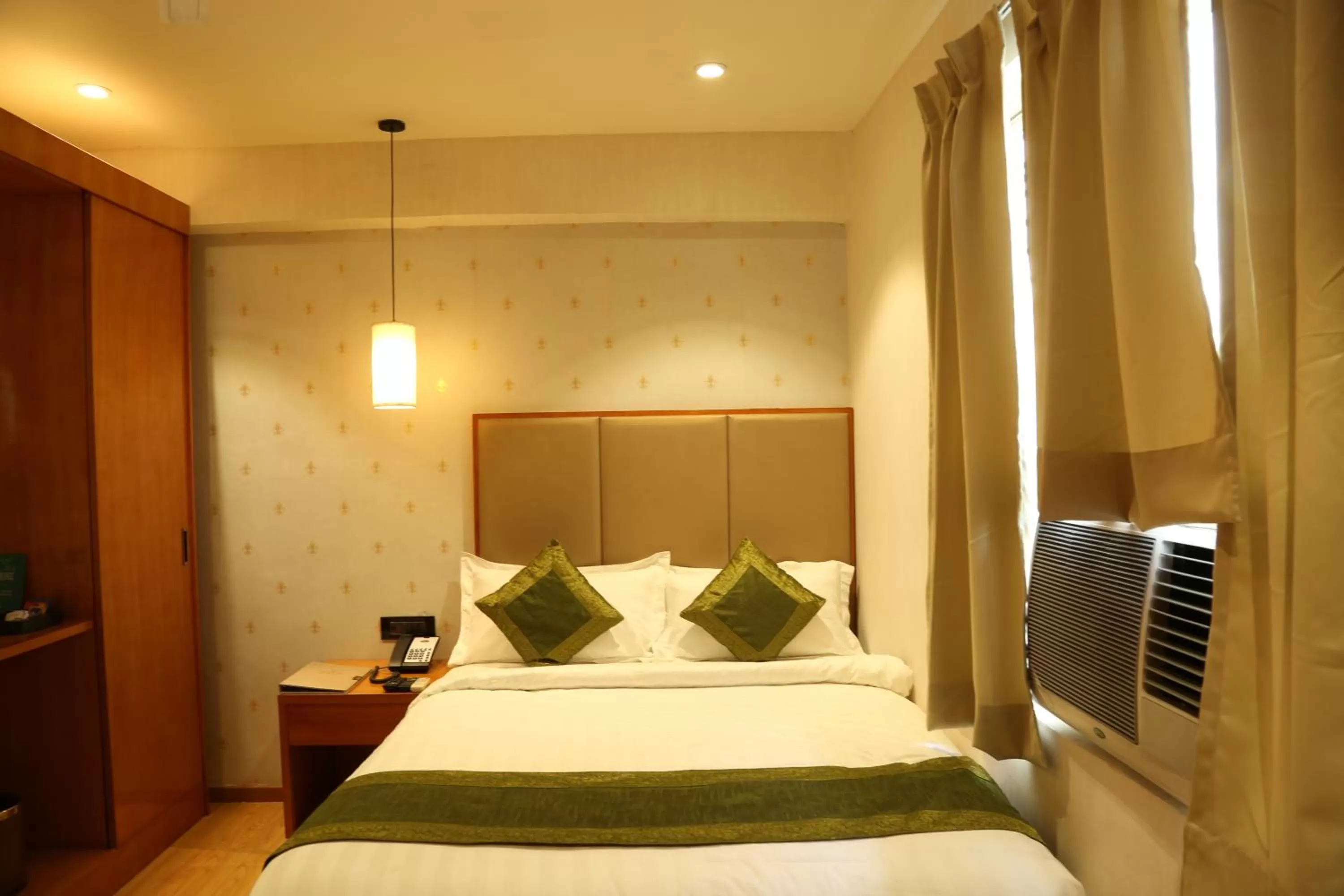 Bed in Hotel Reva Regency