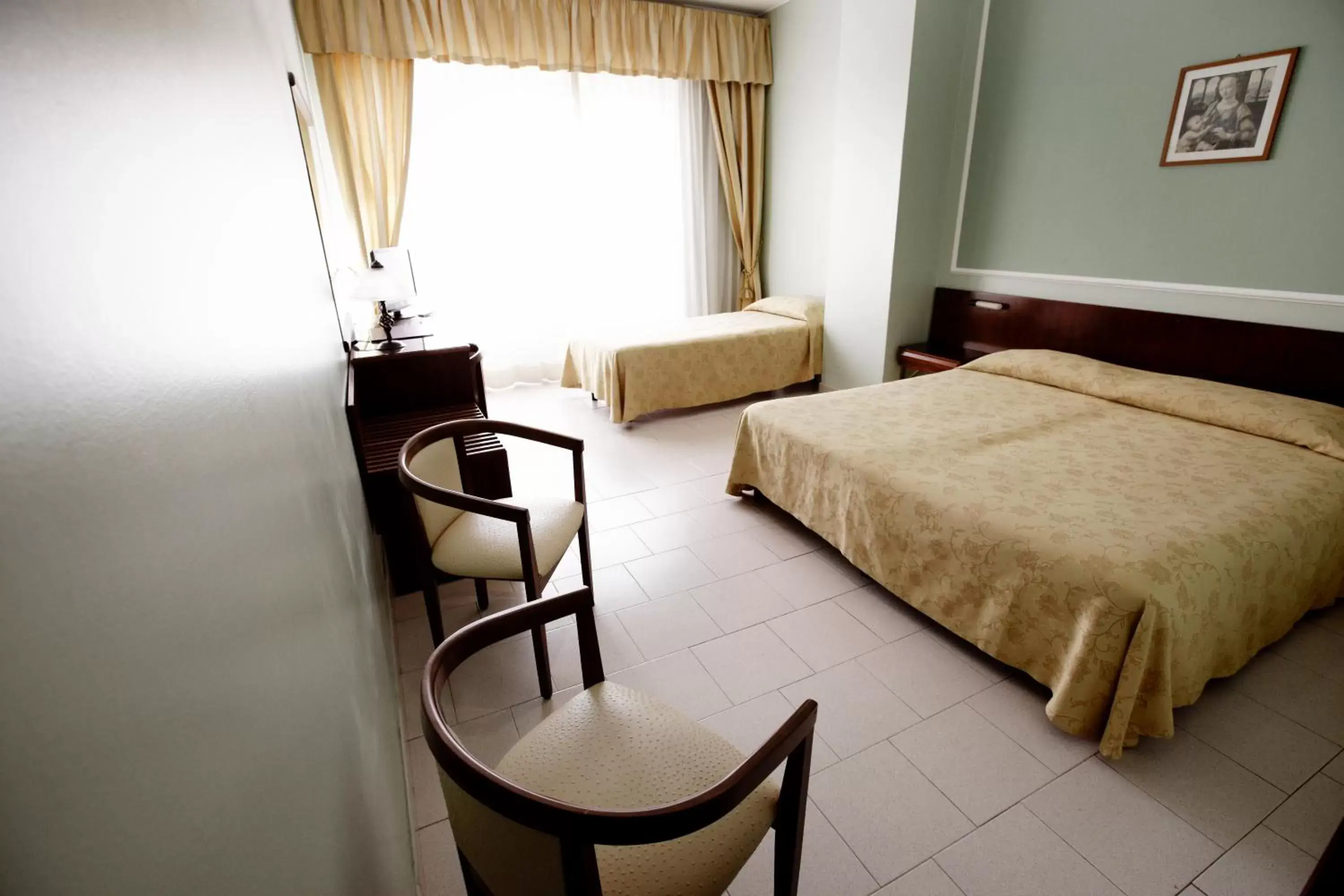 Family Room (2 Adults + 1 Child) in Hotel Continental Family Room (2 Adults + 1 Child) in Hotel Continental