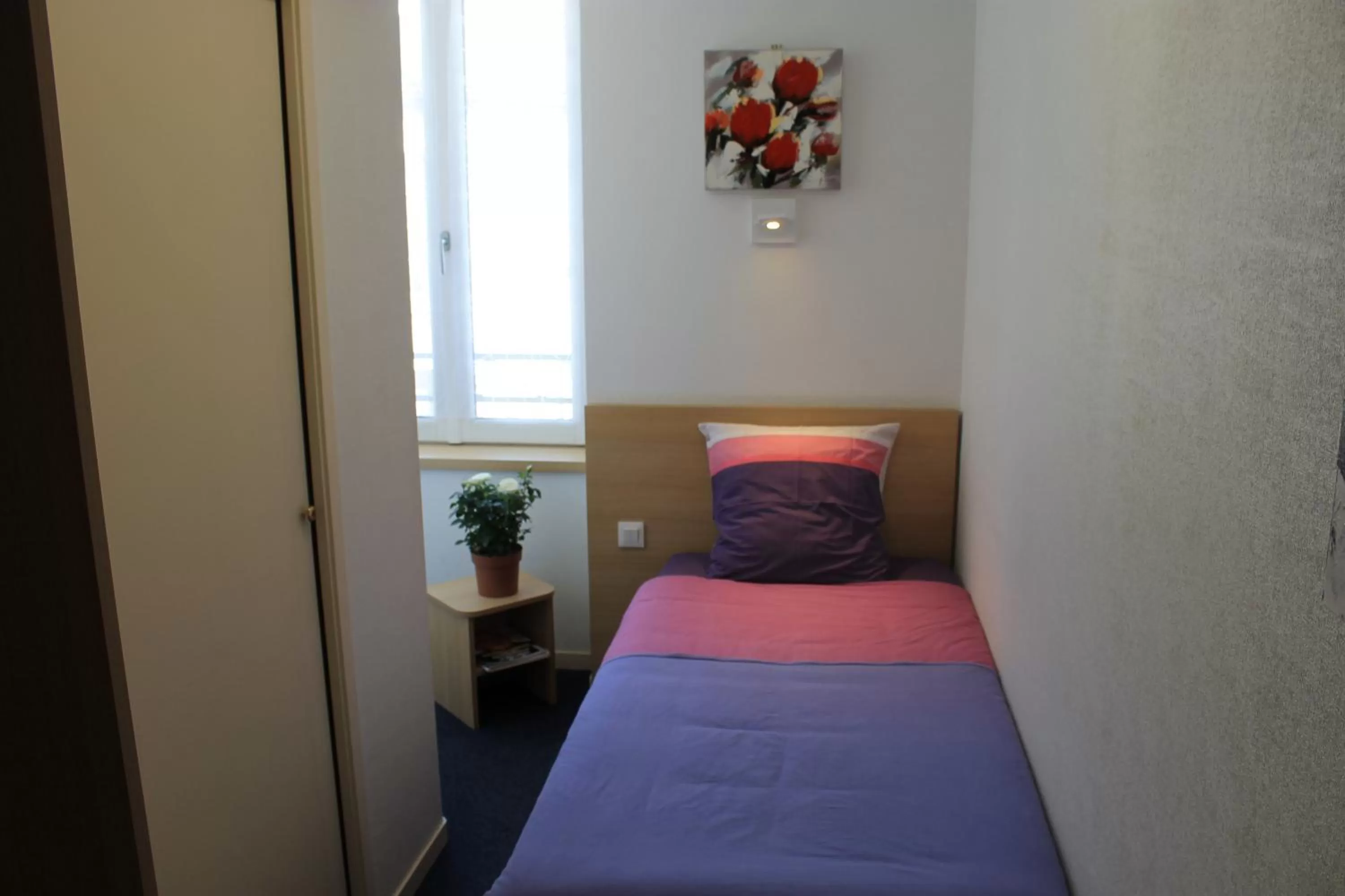 Bed in Hôtel du lion d'or