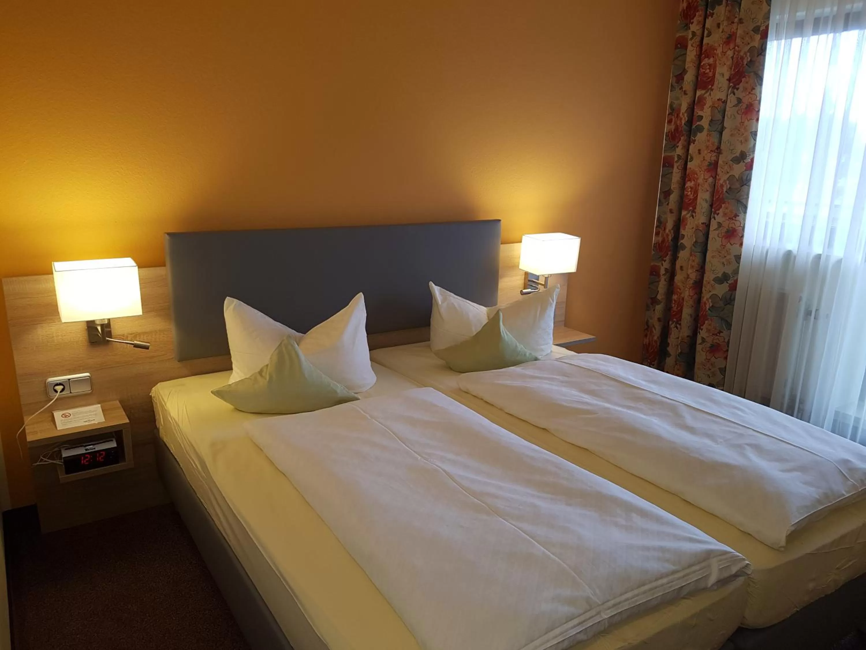 Bed in Hotel Merian Rothenburg