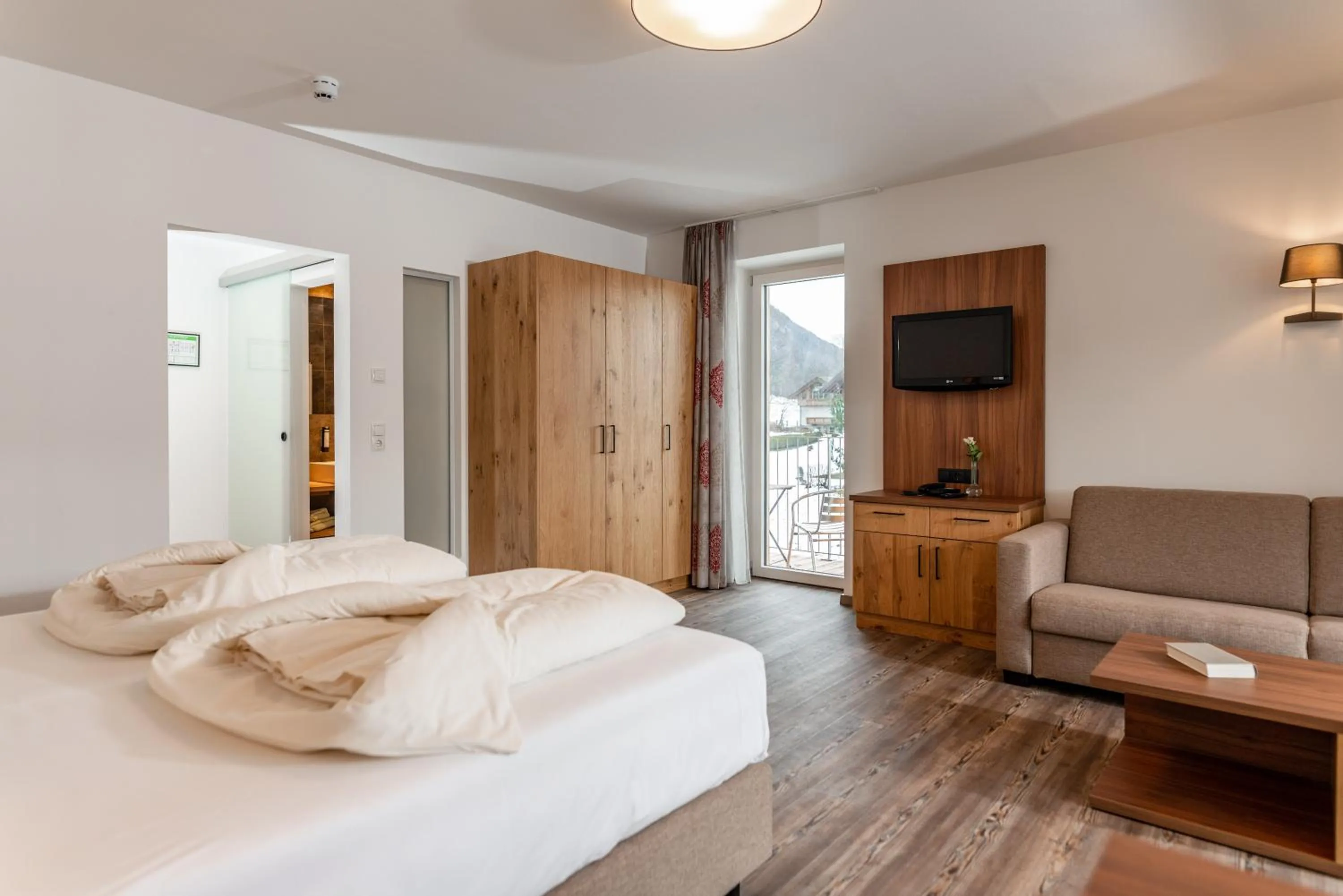 Photo of the whole room, Bed in Aktivhotel Pehab - Dachstein Rooftop-Spa
