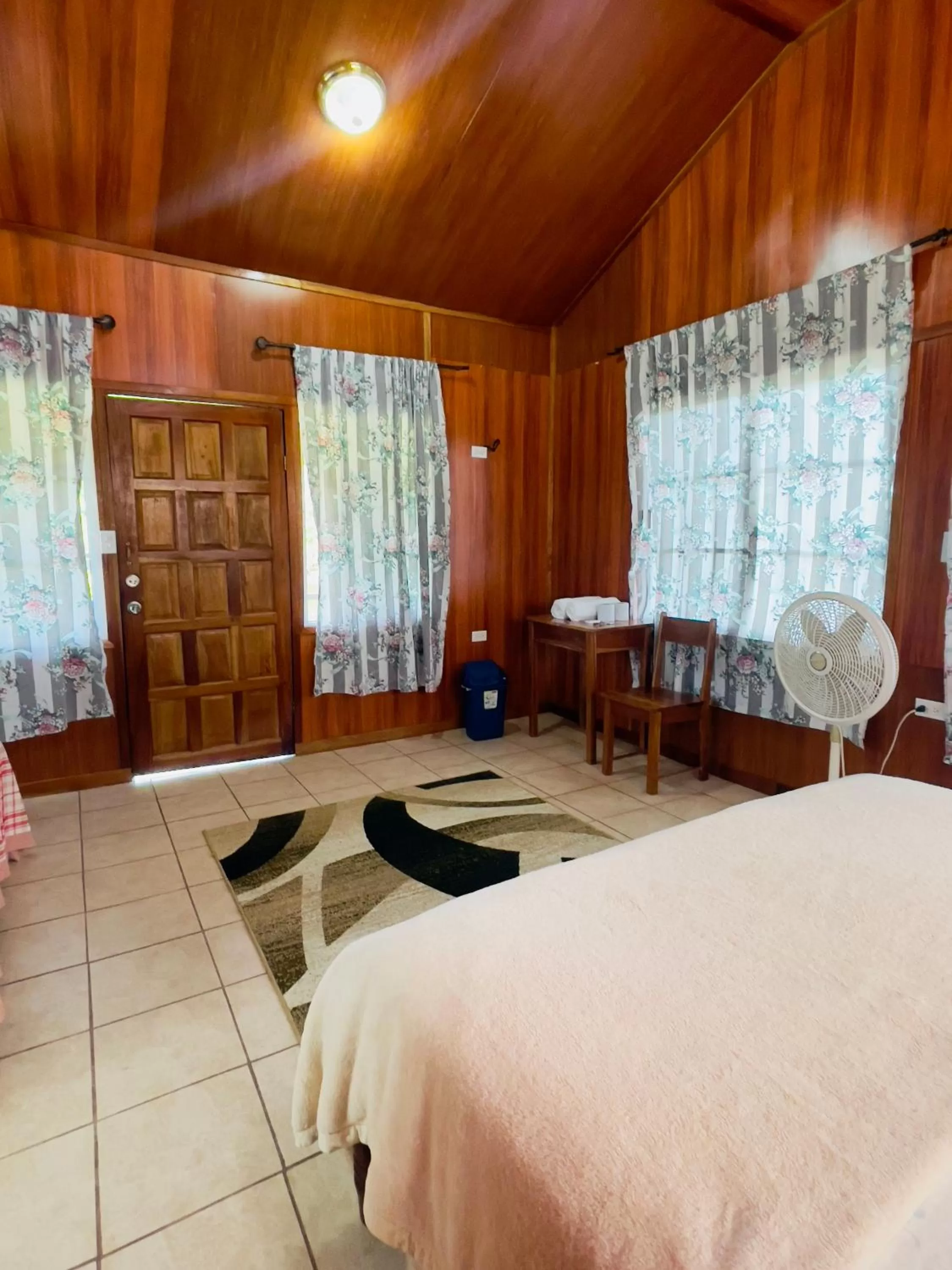 Bed in Lamanai Riverside Retreat