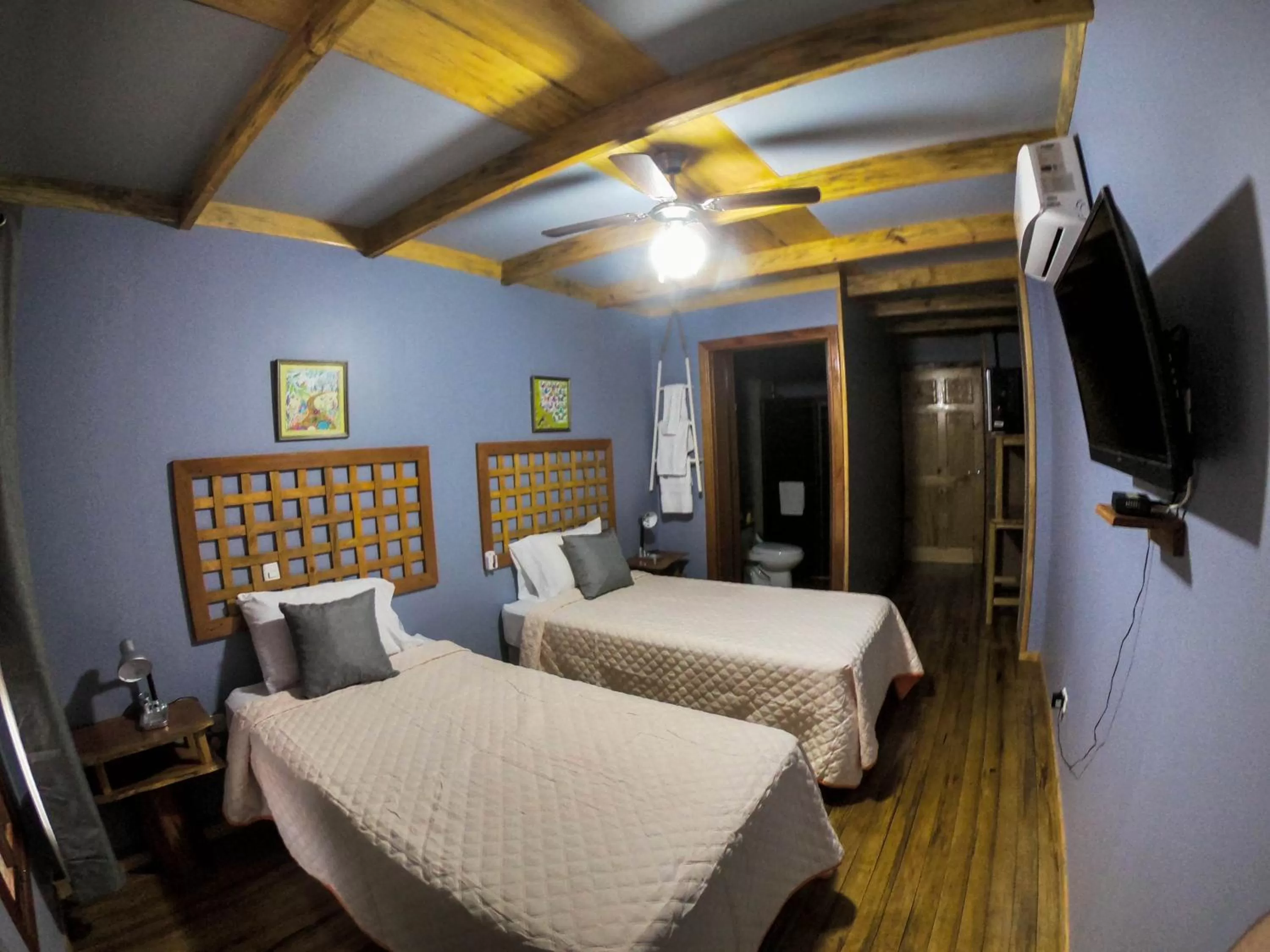 Communal lounge/ TV room, Bed in Hotel Hacienda Don Paolo