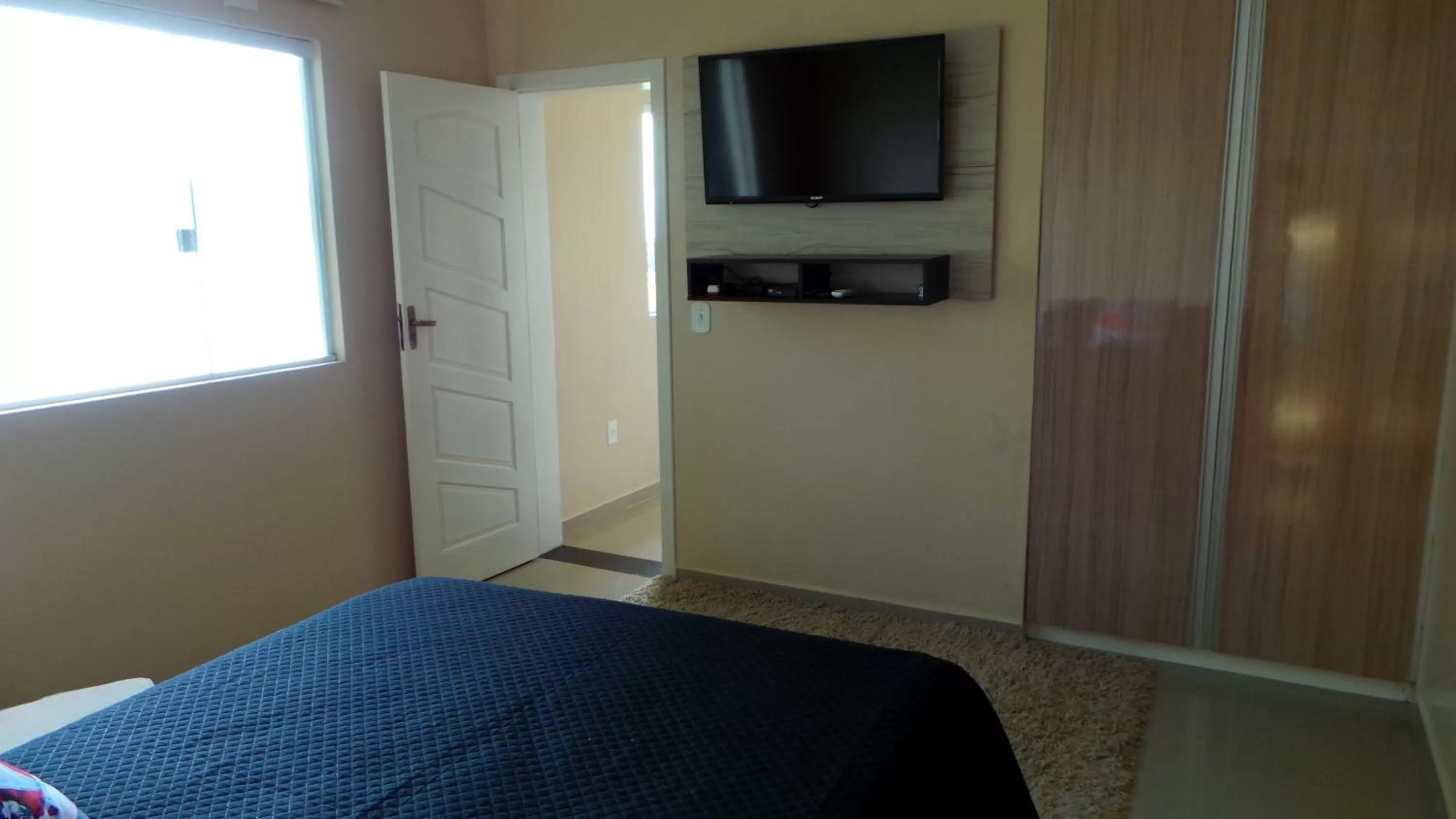 Photo of the whole room, TV/Entertainment Center in Ocean Green Flats