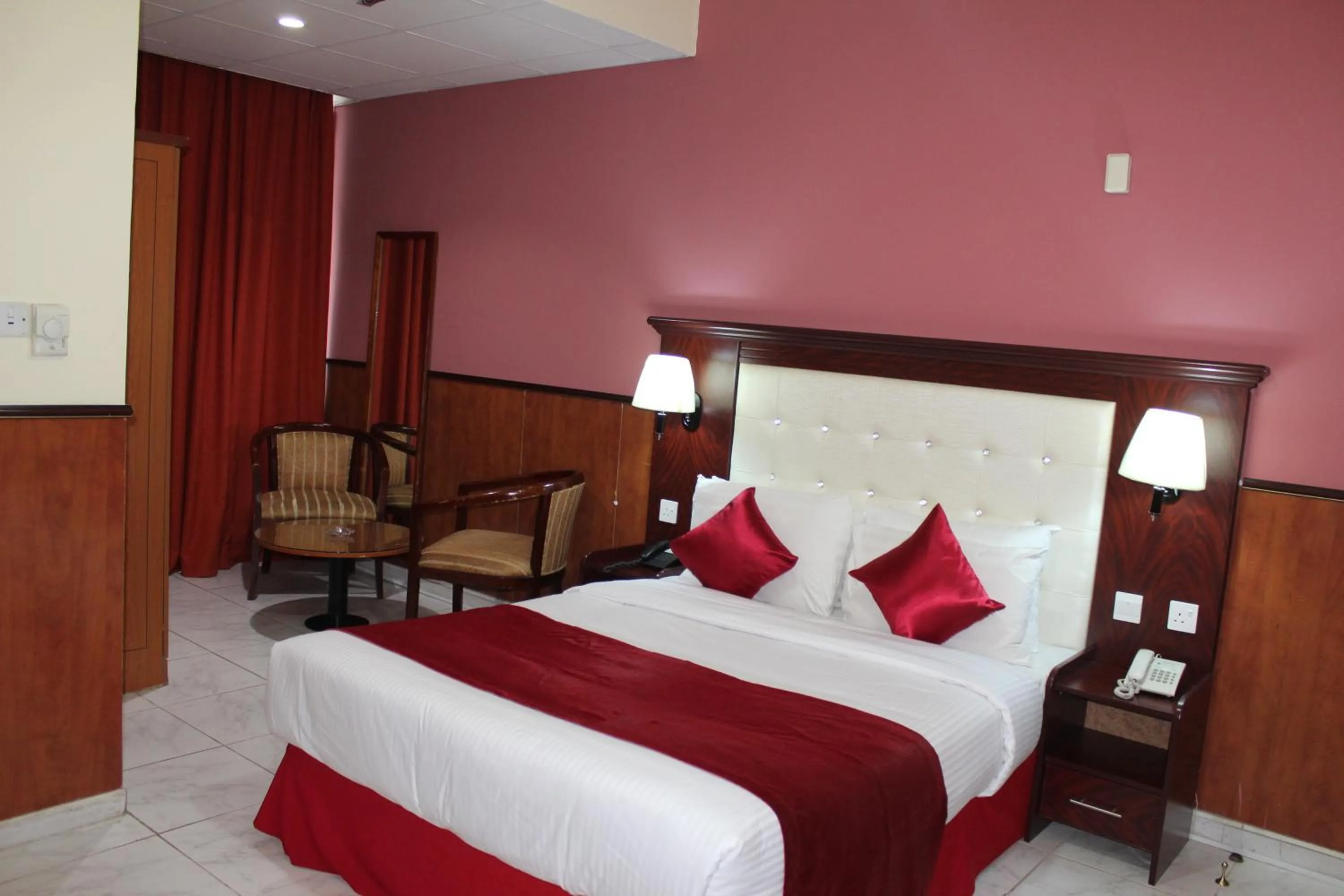 Bed in Grand Nova Hotel