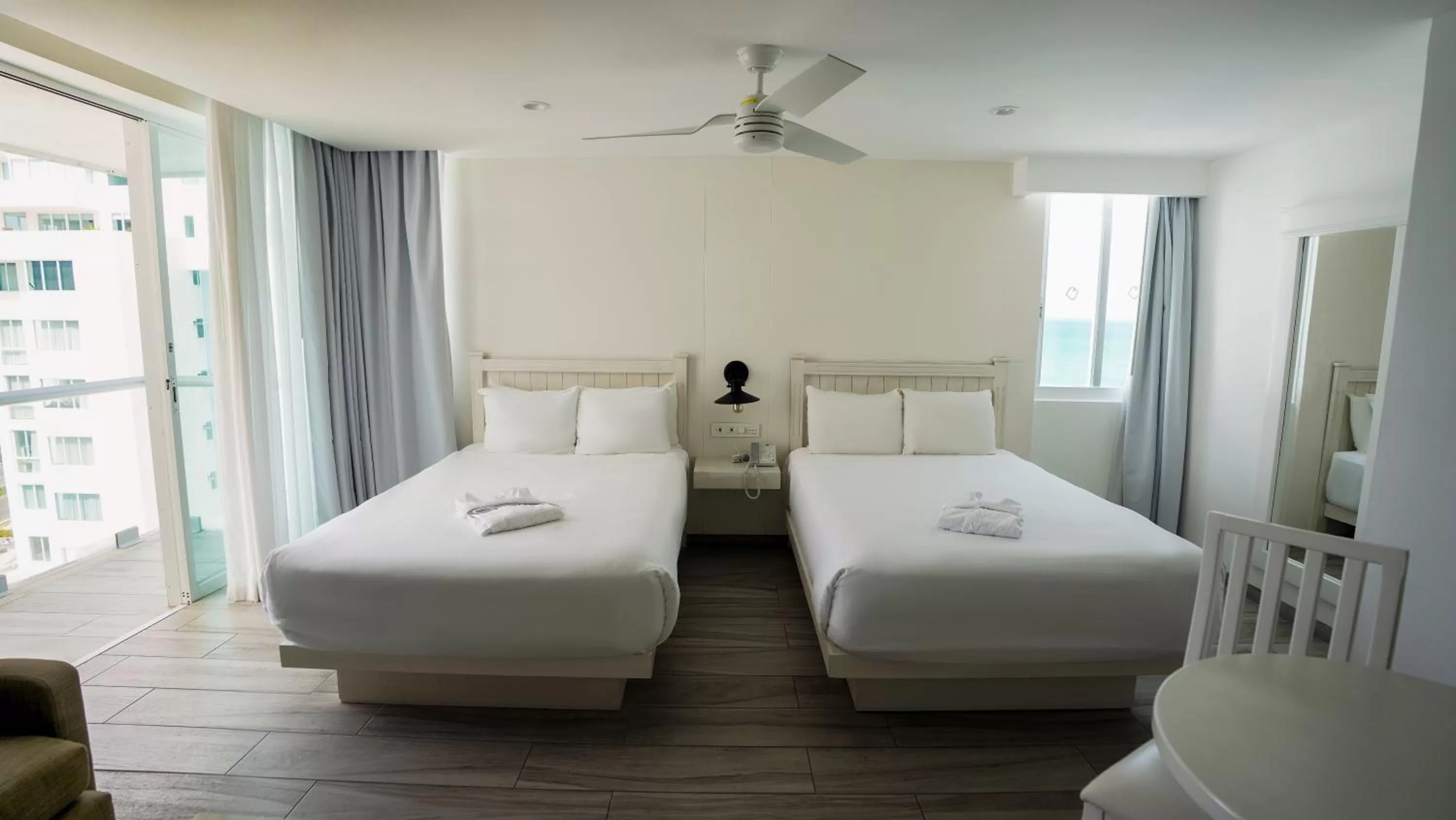 Bed in Oleo Cancun Playa All Inclusive Resort