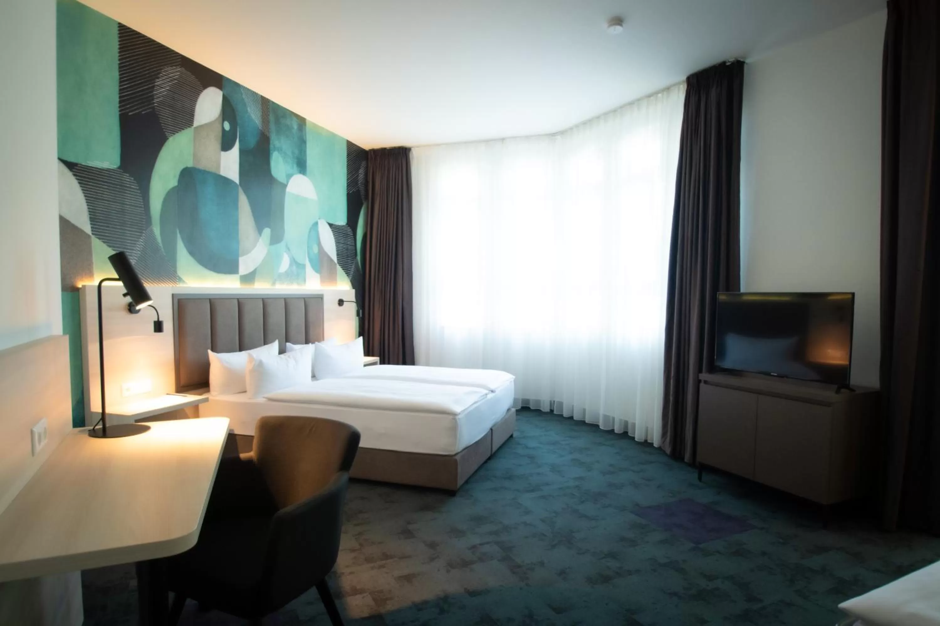 Photo of the whole room, Bed in Taste Hotel Kulmbach