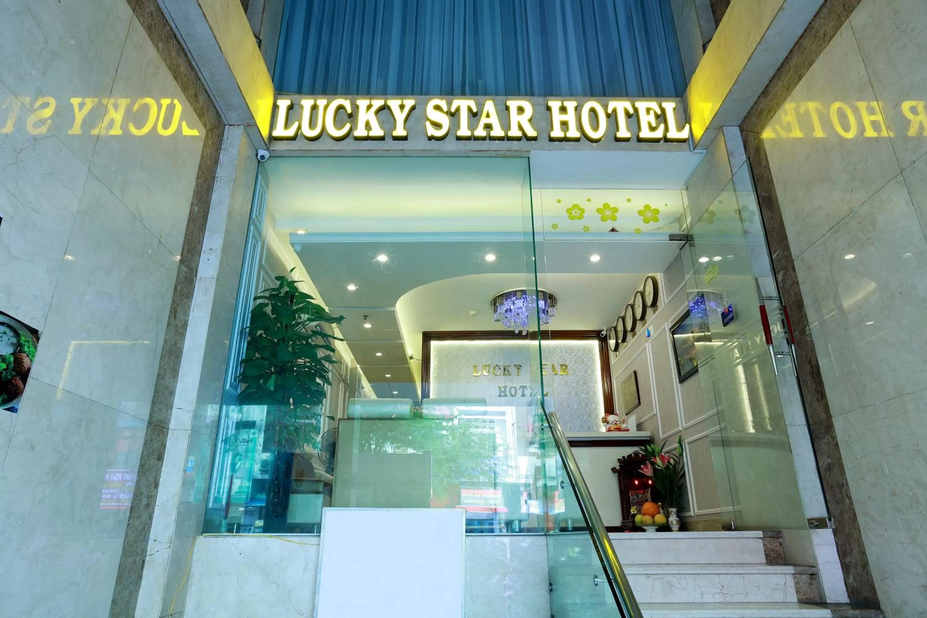 Property logo or sign in Lucky Star Hotel 266 De Tham