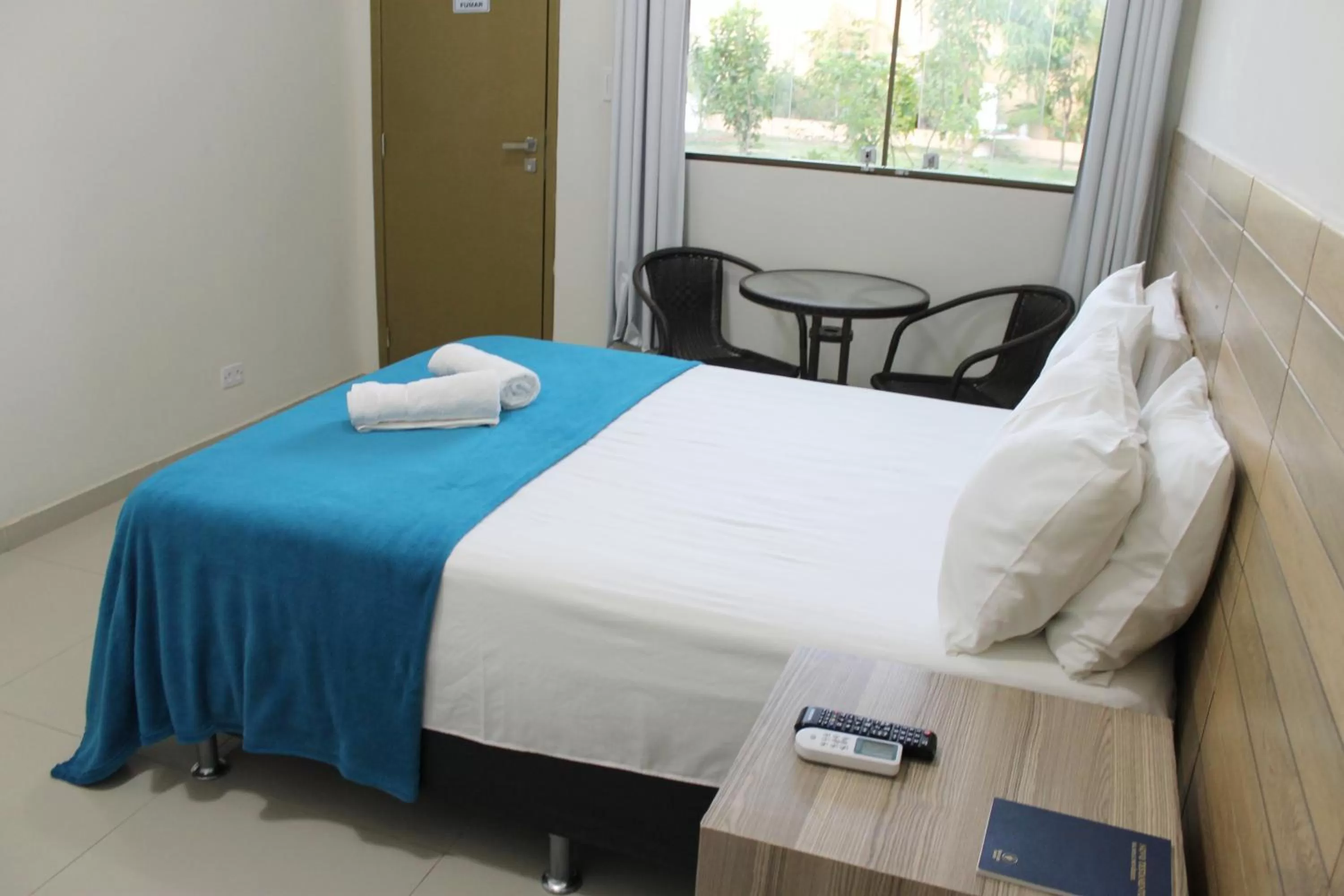 Bed in Pousada Das Palmeiras