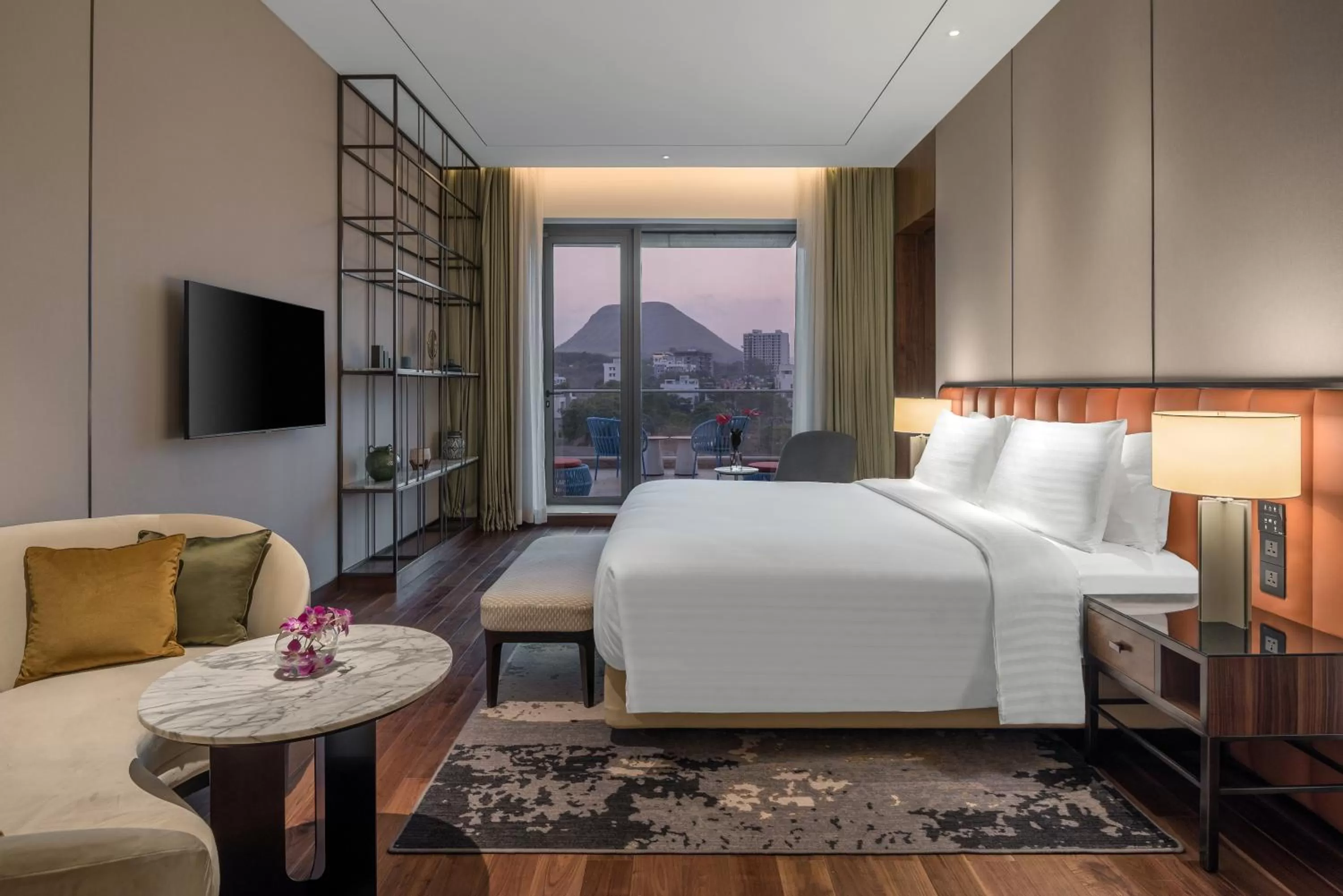 Communal lounge/ TV room, Bed in Radisson Blu Hotel & Spa, Nashik