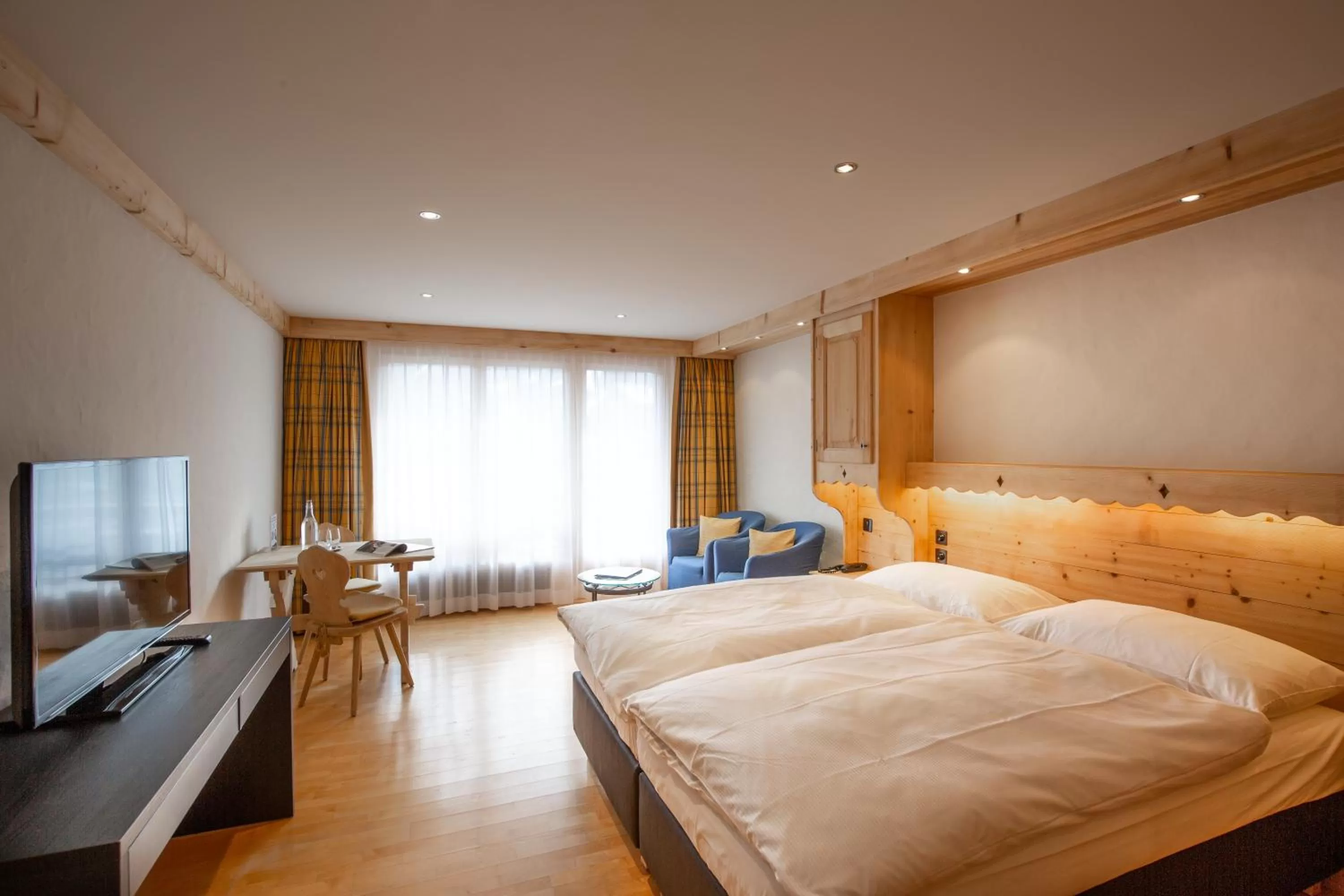 Photo of the whole room, Bed in Bernerhof Swiss Quality Hotel Gstaad