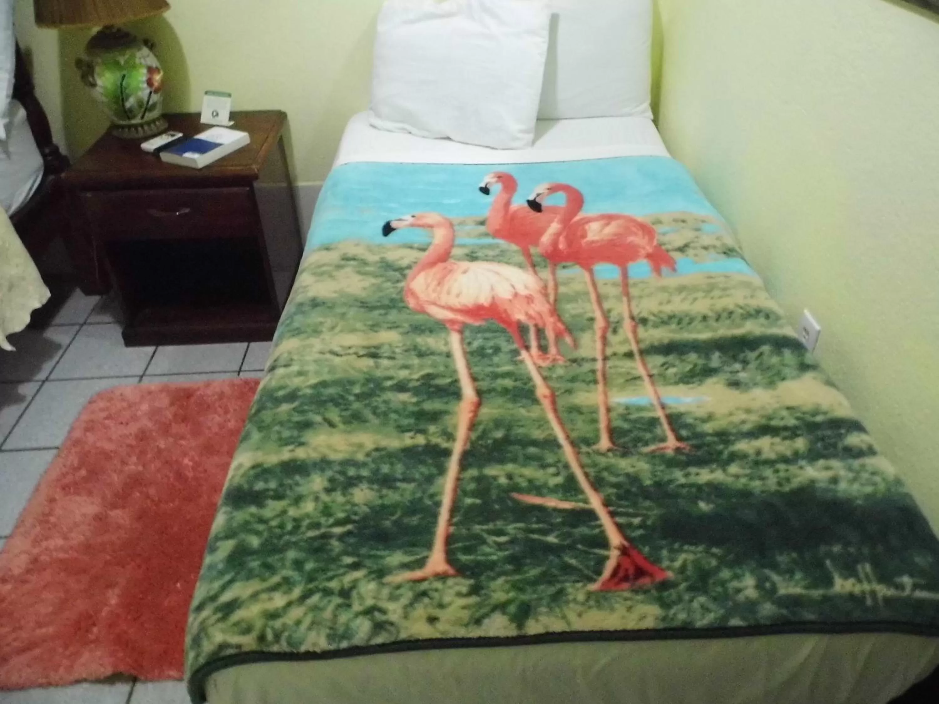 Bed in Alan's Paradise Hotel