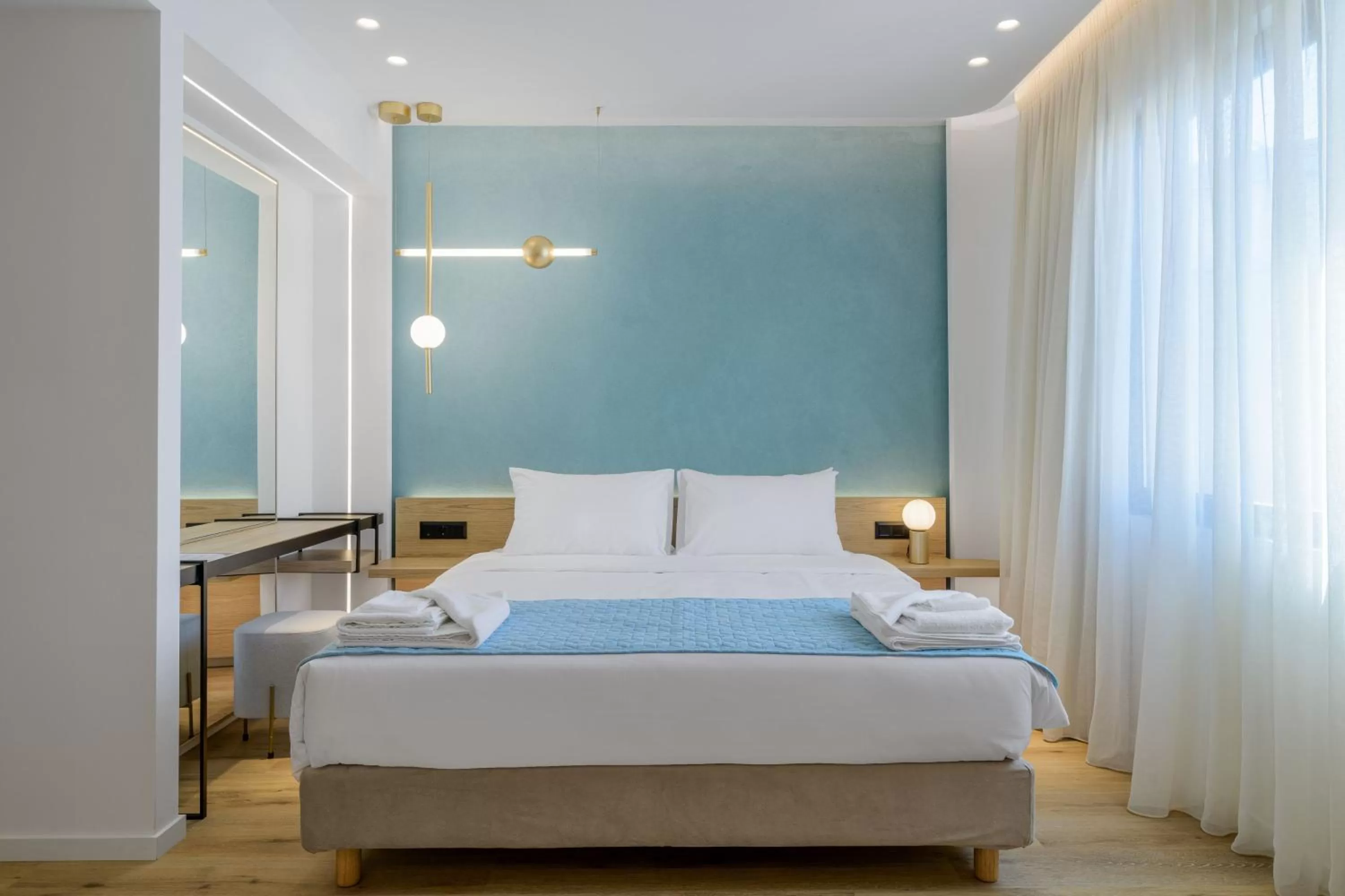 Bed in Acropolis Magenta Luxury Suites