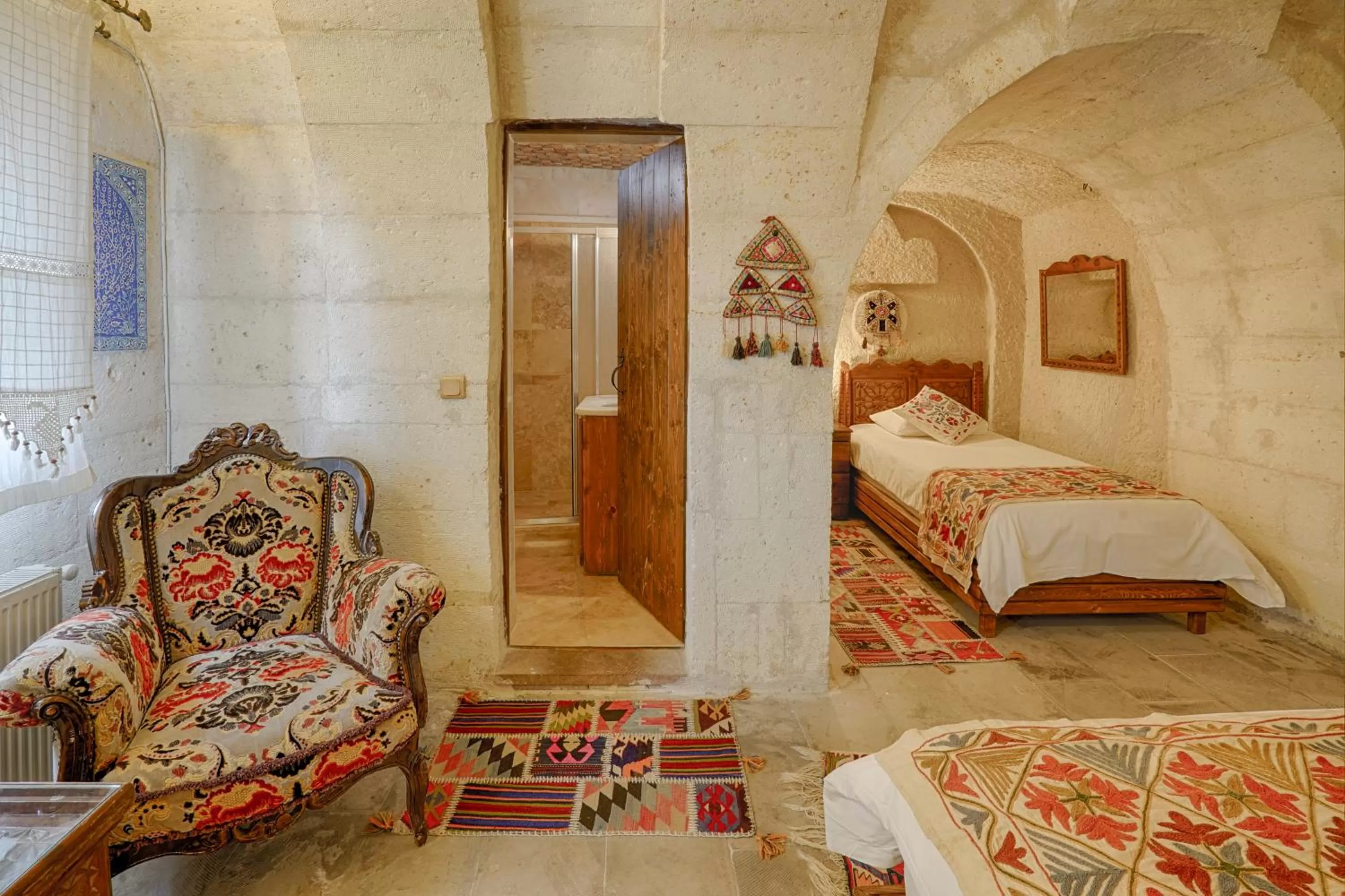 Bed in Tulip Cave Suites