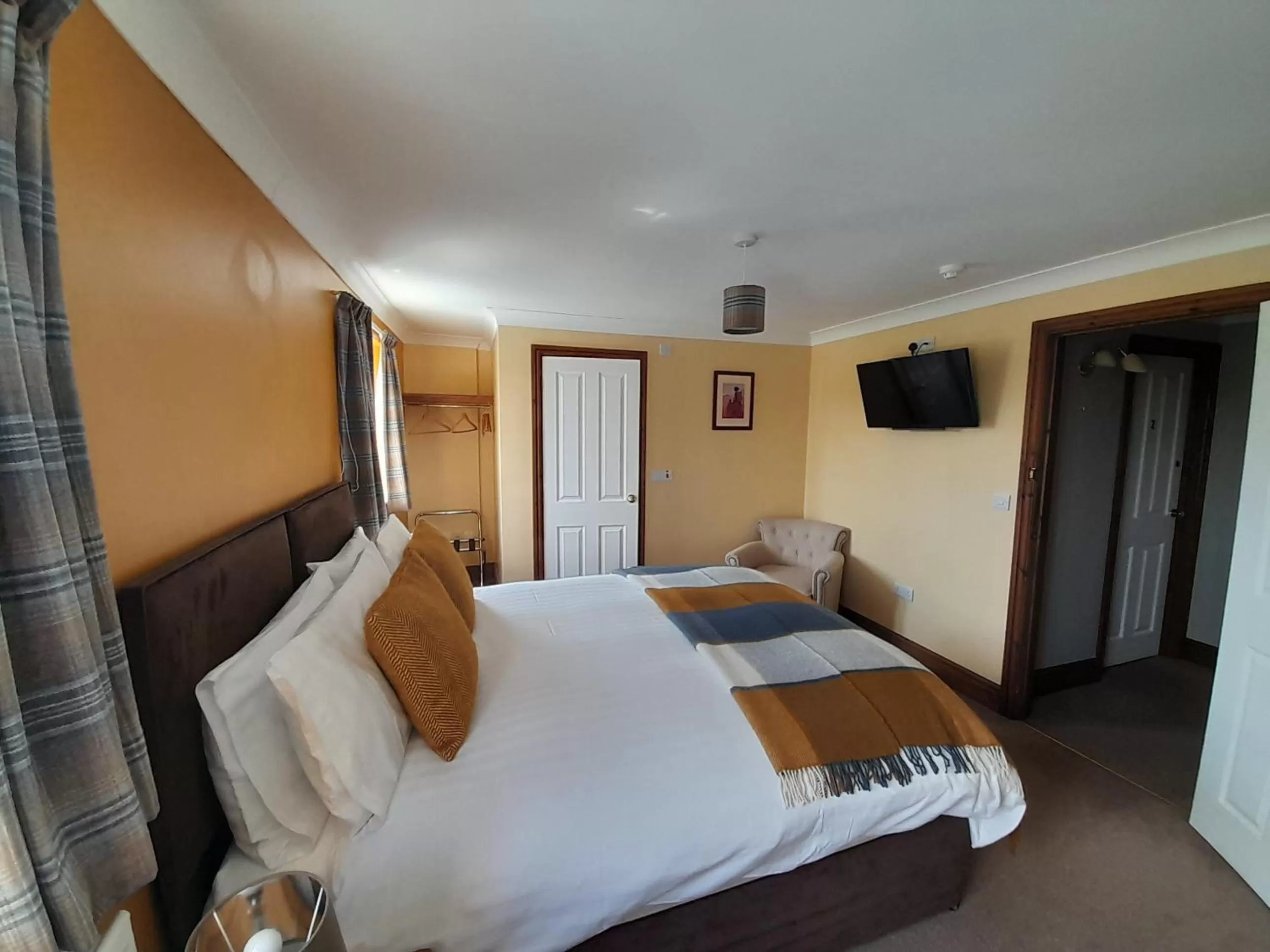 Bed in The Dolfor Inn