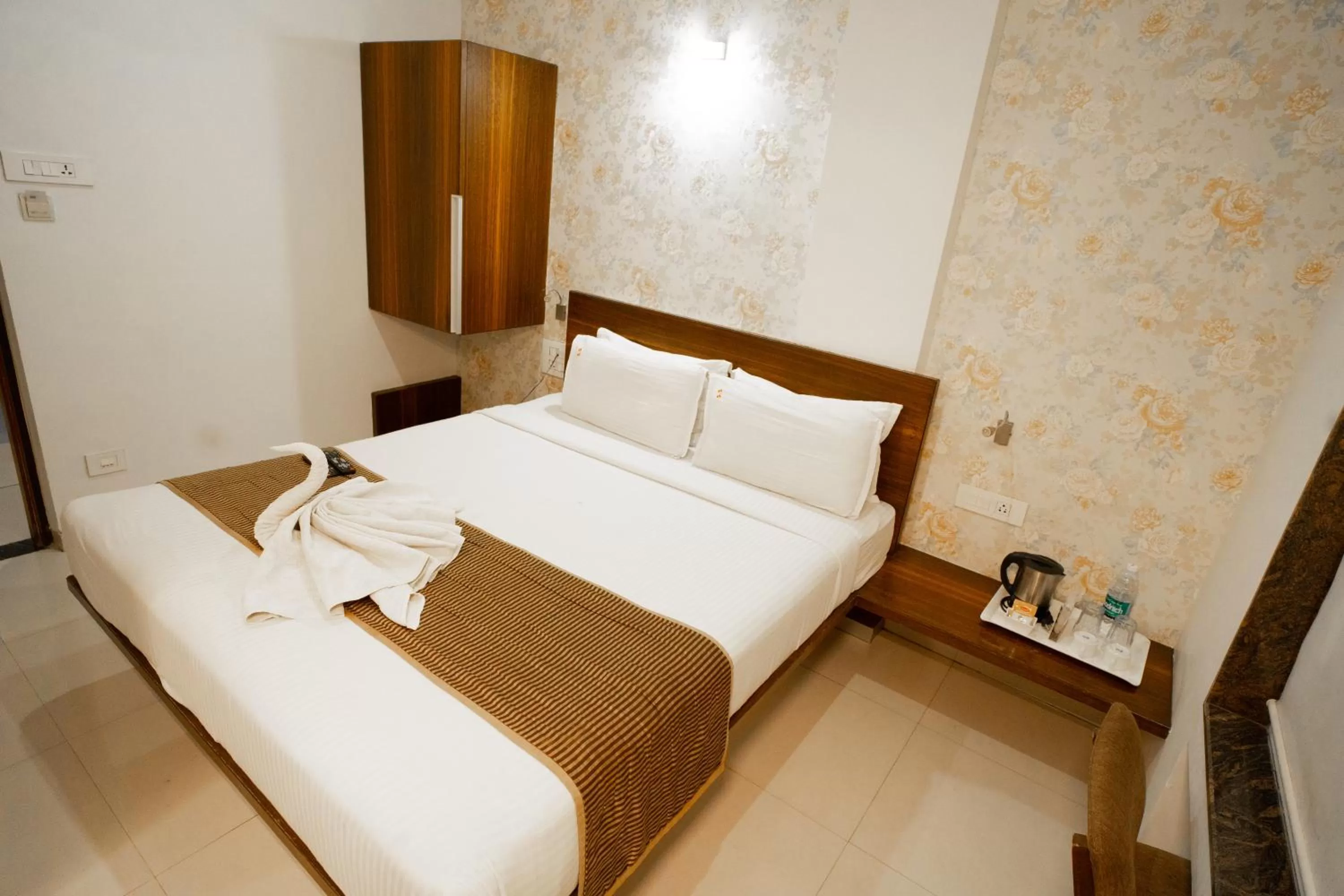 Bed in Hotel SRI SRI EXECUTIVE KOLHAPUR NEAR MAHALAXMI TEMPLE