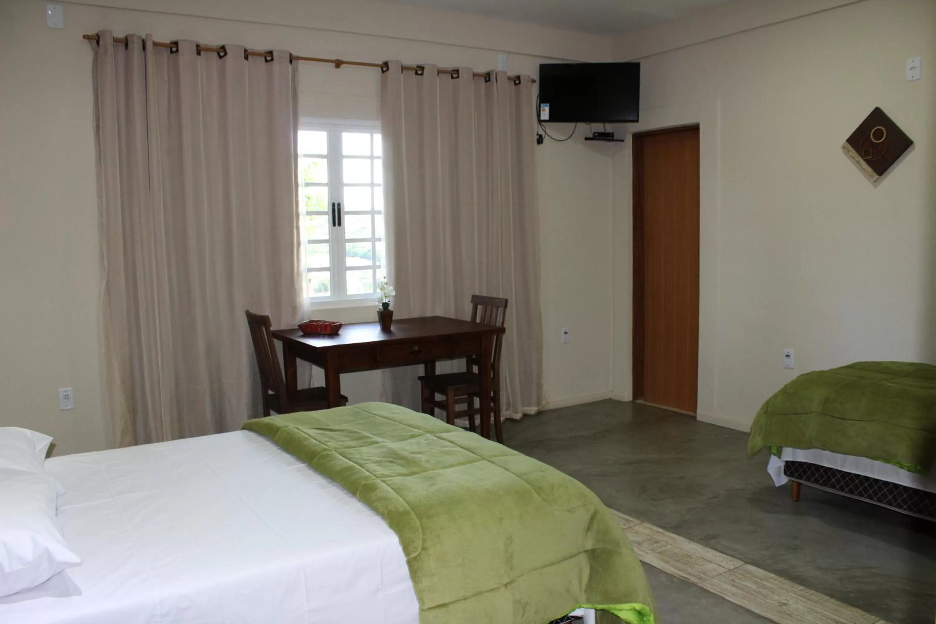 Bed in Pousada Morro dos Ventos