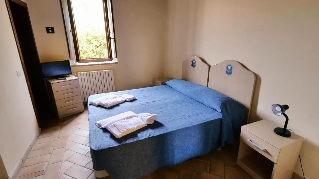 Bed in Borgo de' Varano by Hotel I Duchi