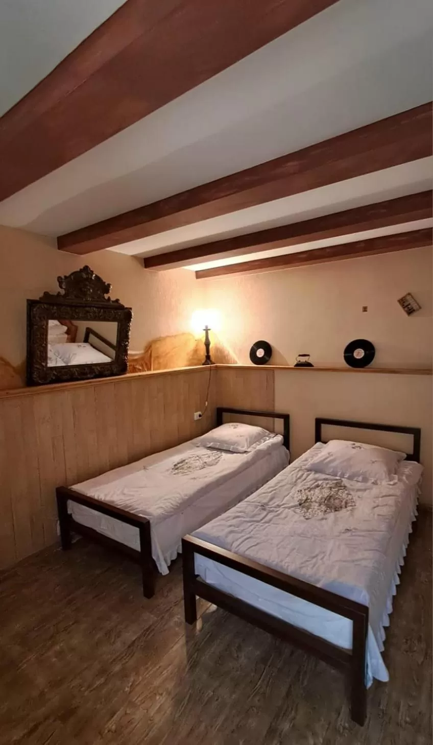 Bed in Qilimcha's Guesthouse