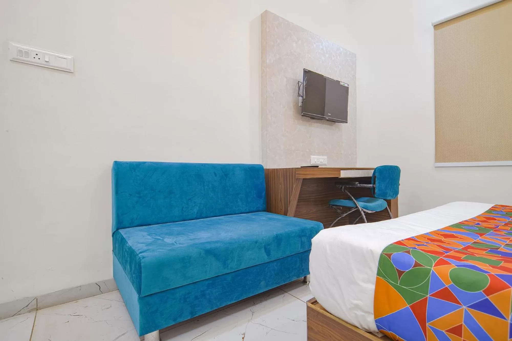 Bed, Seating Area in FabHotel Ramya