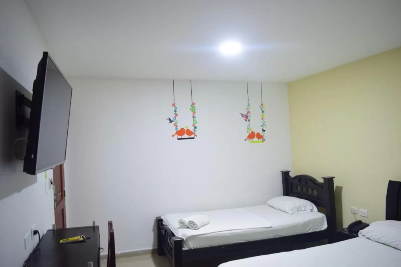 Bed in Hotel Intersuites