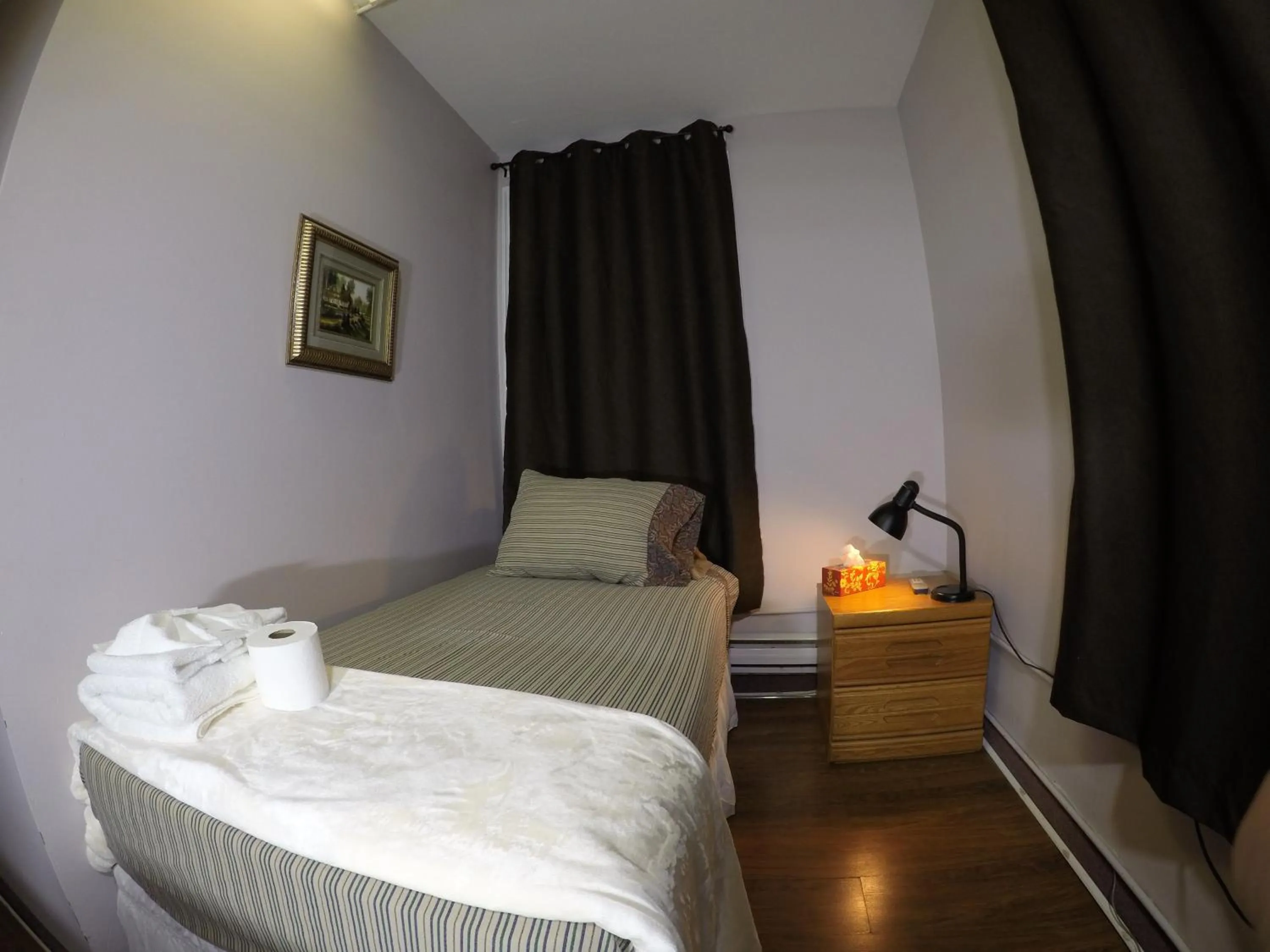 Photo of the whole room, Bed in Saint Lawrence Residences and Suites